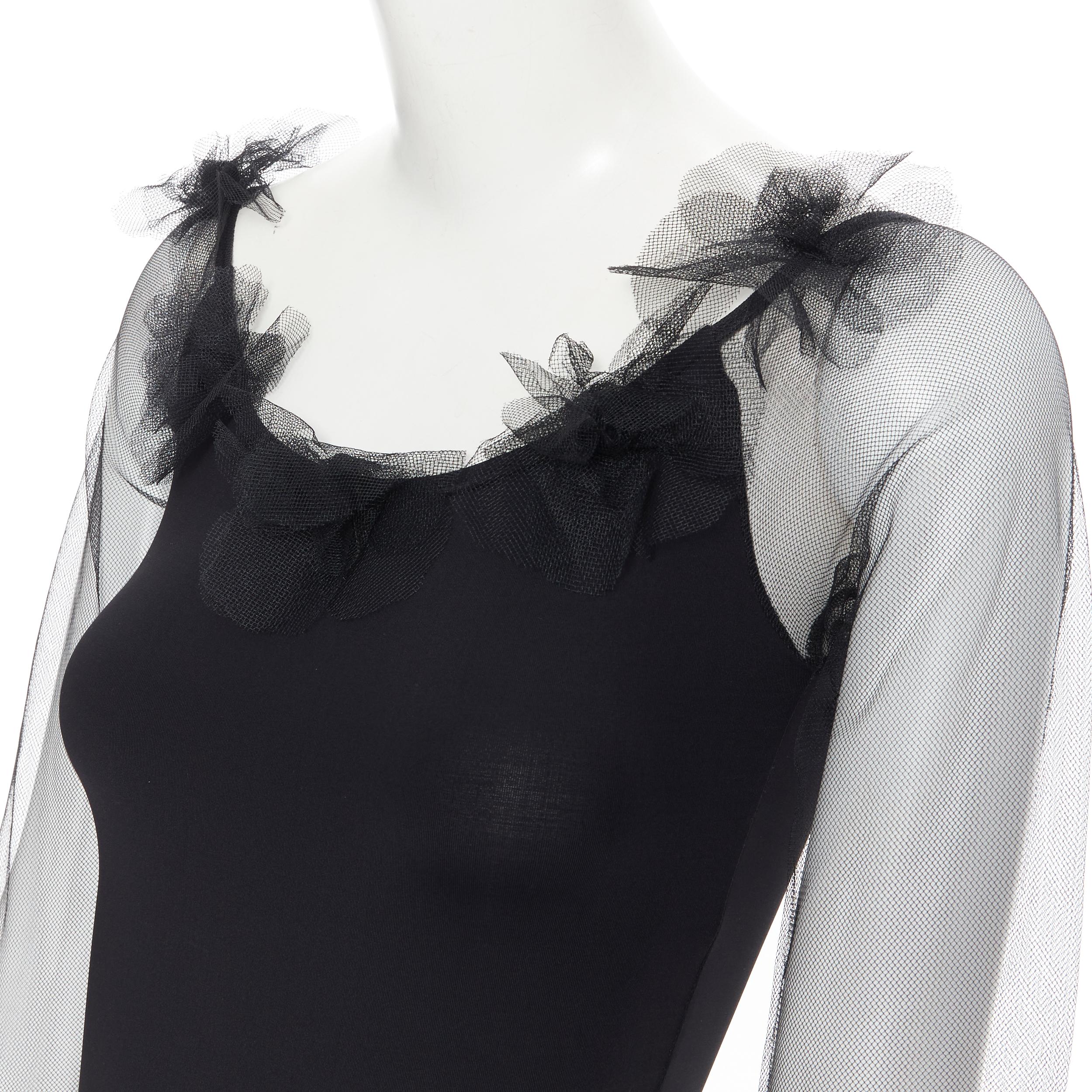new MOSCHINO Cheap Chic black sheer sleeve ruffle pom trim bodysuit top IT40 S 
Reference: TGAS/B01033 
Brand: Moschino 
Material: Polyester 
Color: Black 
Pattern: Solid 
Extra Detail: Ruffle with black pom pom trimming along collar. Sheer sleeves.