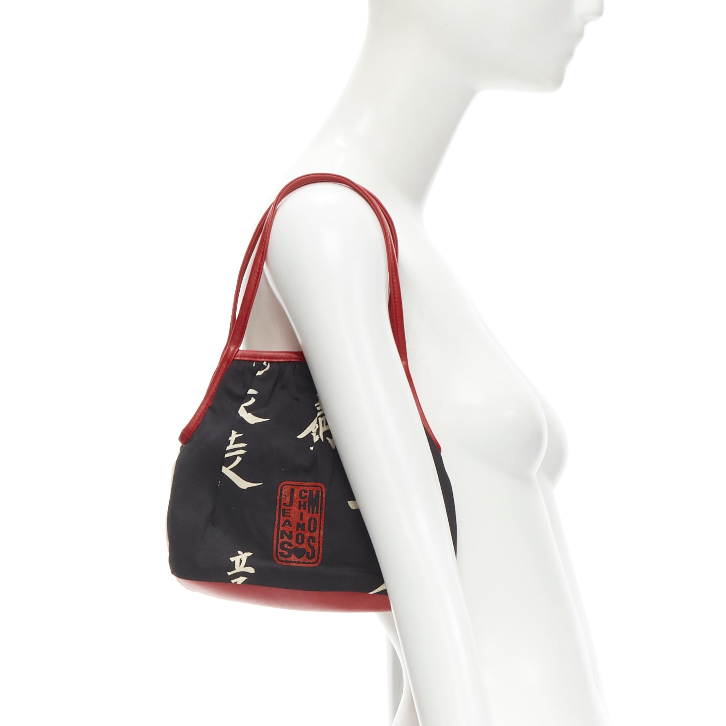 new MOSCHINO Cheap Chic Japonais print cotton red leather trim bag
Brand: Moschino
Designer: Jeremy Scott
Material: Cotton
Color: Black
Pattern: Abstract
Closure: Magnet
Extra Detail: Leather trim top handle.
Made in: Italy

CONDITION:
Condition: