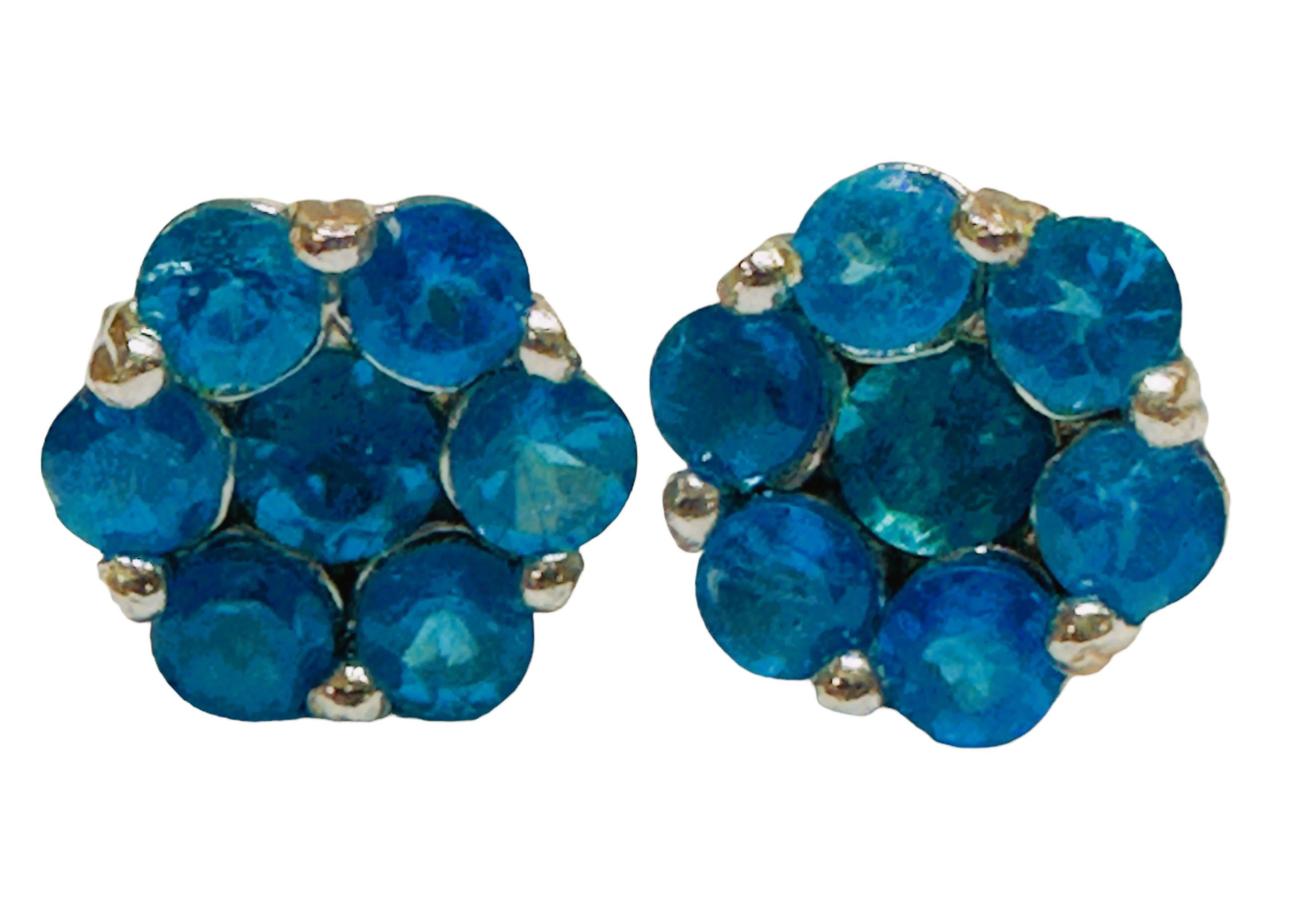 These earrings are just gorgeous!  The photos just don't do them justice.  The stones are from Mozambique and each earring has 7 round cut stones totalling  1.94 cts each.  They are post earrings and have butterfly backs that are stamped 