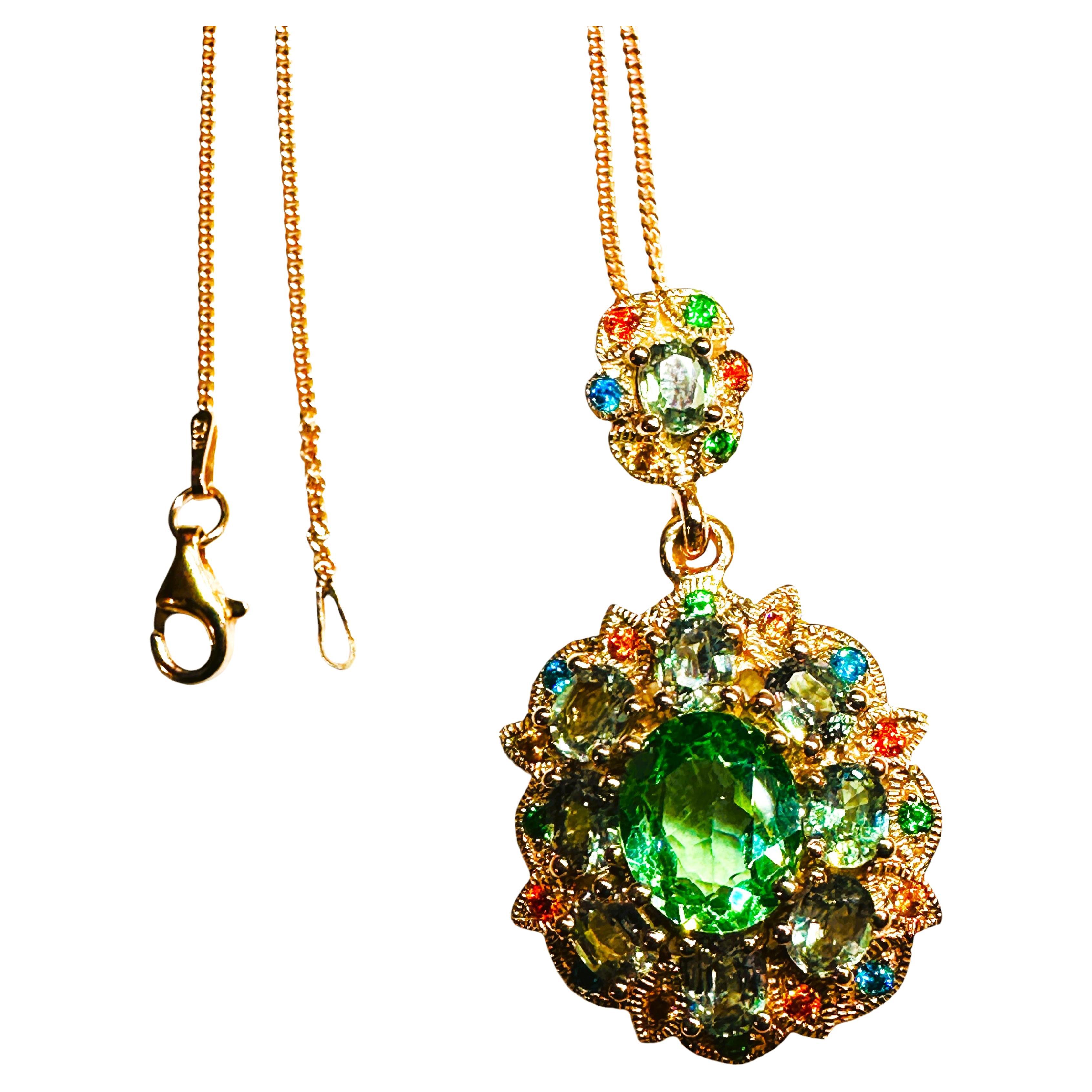 The stones are from Africa and is just exquisite. The main stone is a seafoam green tourmaline and is 5.02 cts.  The stone is oval cut and measures 10.5 x 9.1 mm and is 5.02 carats.  The stone is surrounded by oval cut blue sapphires and then