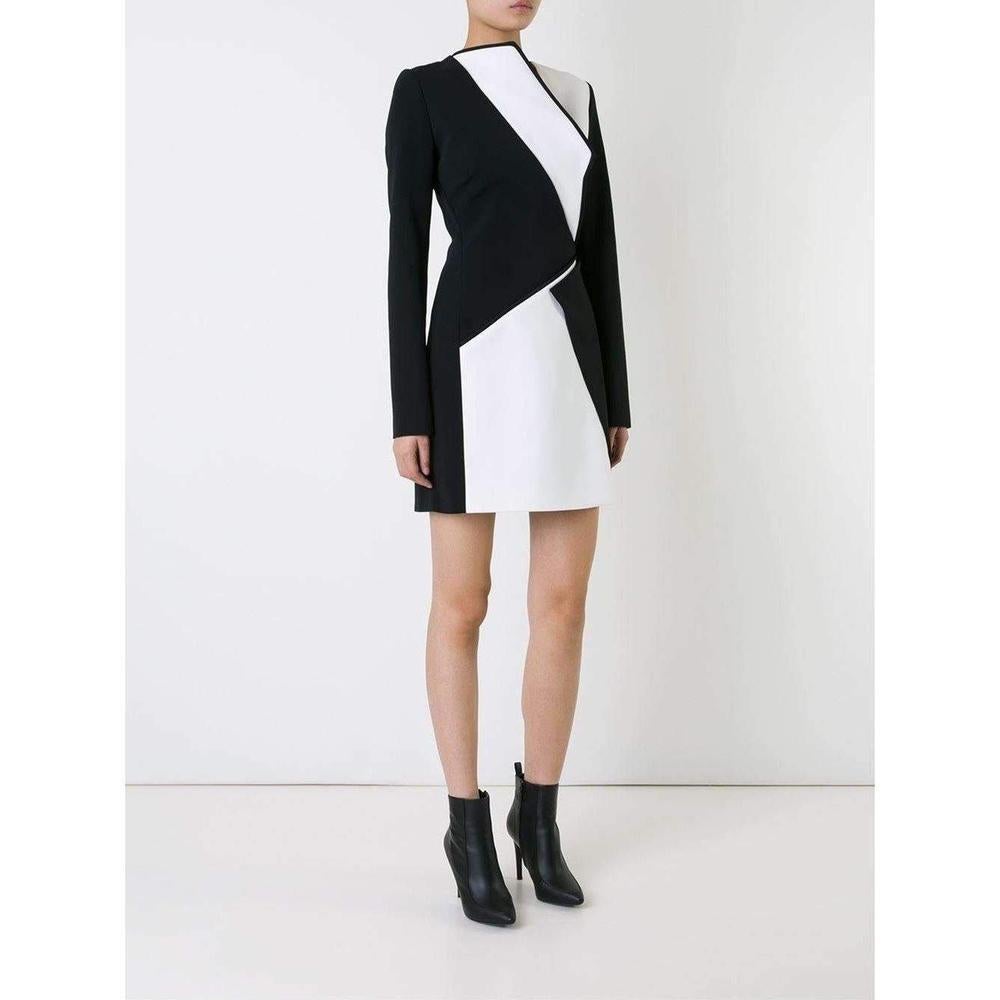 Super-sharp bodycon dresses are Mugler's speciality, and this black and white bonded-crepe design is a slick proposition. Bold monochrome splices are carefully placed to contour the figure, while long sleeves temper the impact of the thigh-high