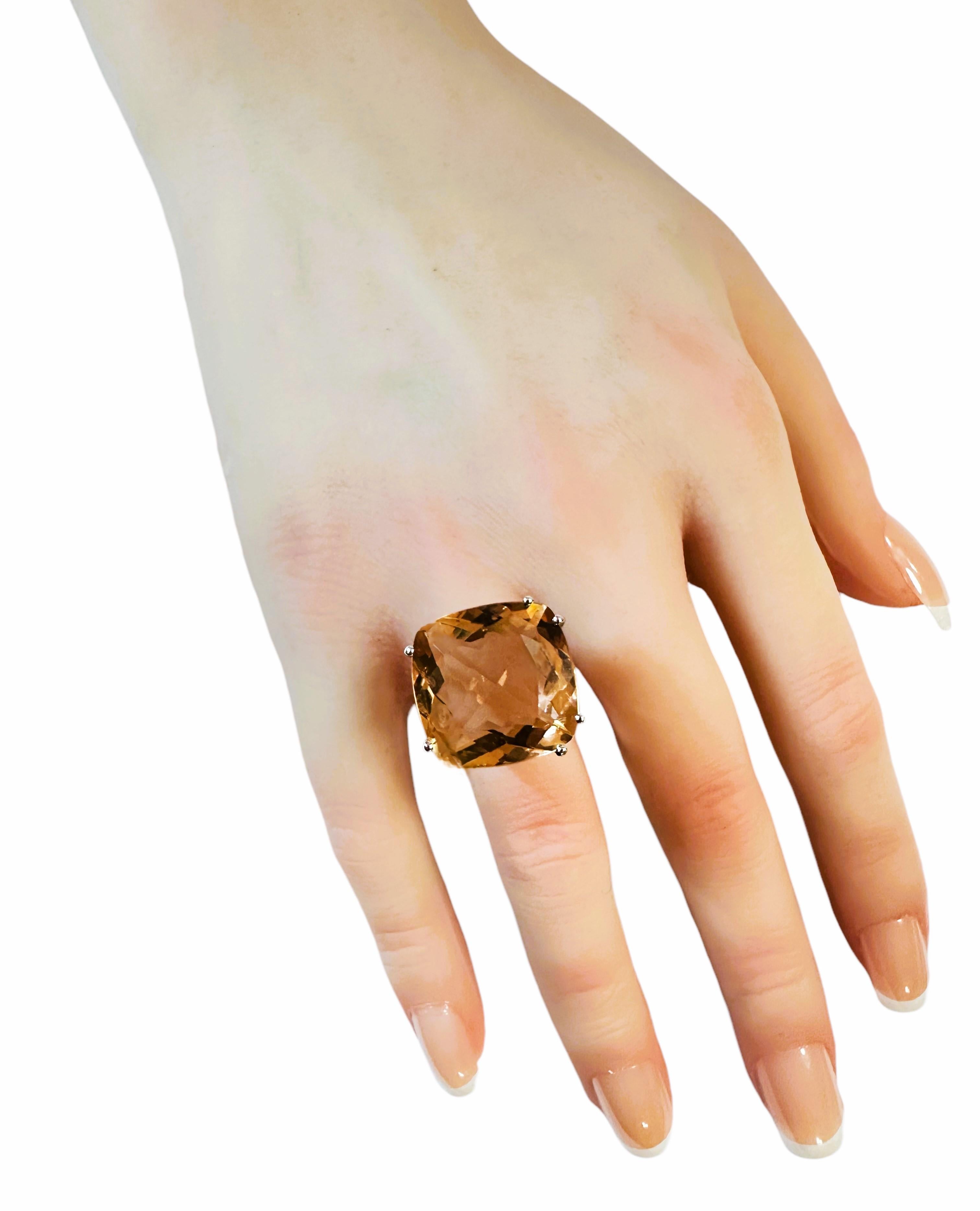 The cut of this stone and design of this ring is just phenomenal. The ring is a size 6.25.   The stone is from Africa and is just exquisite.  It is a very high quality stone.  It is a fancy cushion cut stone and is 14.2 Cts   The main stone is 18 x