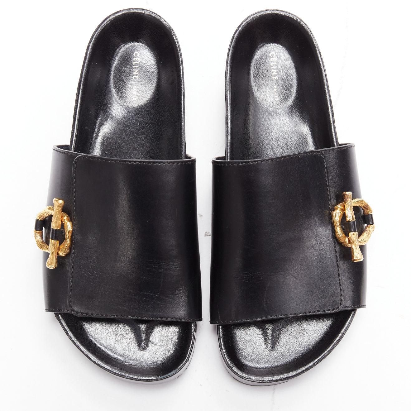 new OLD CELINE Phoebe Philo gold bamboo buckle black leather sandals EU38
Reference: TGAS/D00739
Brand: Celine
Designer: Phoebe Philo
Material: Leather
Color: Black, Gold
Pattern: Solid
Closure: Slip On
Lining: Black Leather
Made in: