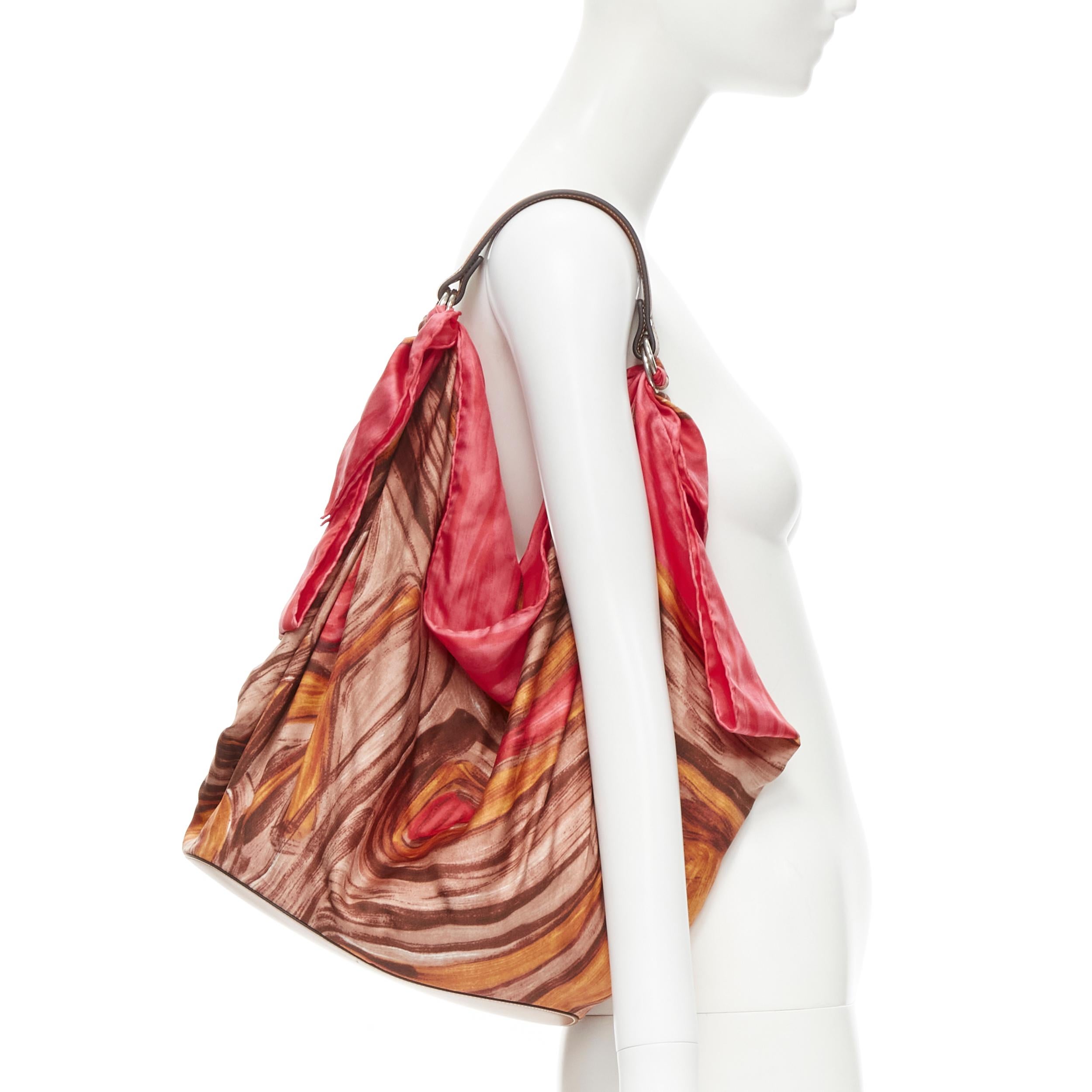 new OLD CELINE Phoebe Philo pink abstract print silk scarf brown leather bag 
Reference: TGAS/B01999 
Brand: Celine 
Designer: Phoebe Philo 
Model: Scarf bag 
Material: Silk 
Color: Pink 
Pattern: Abstract 
Extra Detail: Brown leather handle and