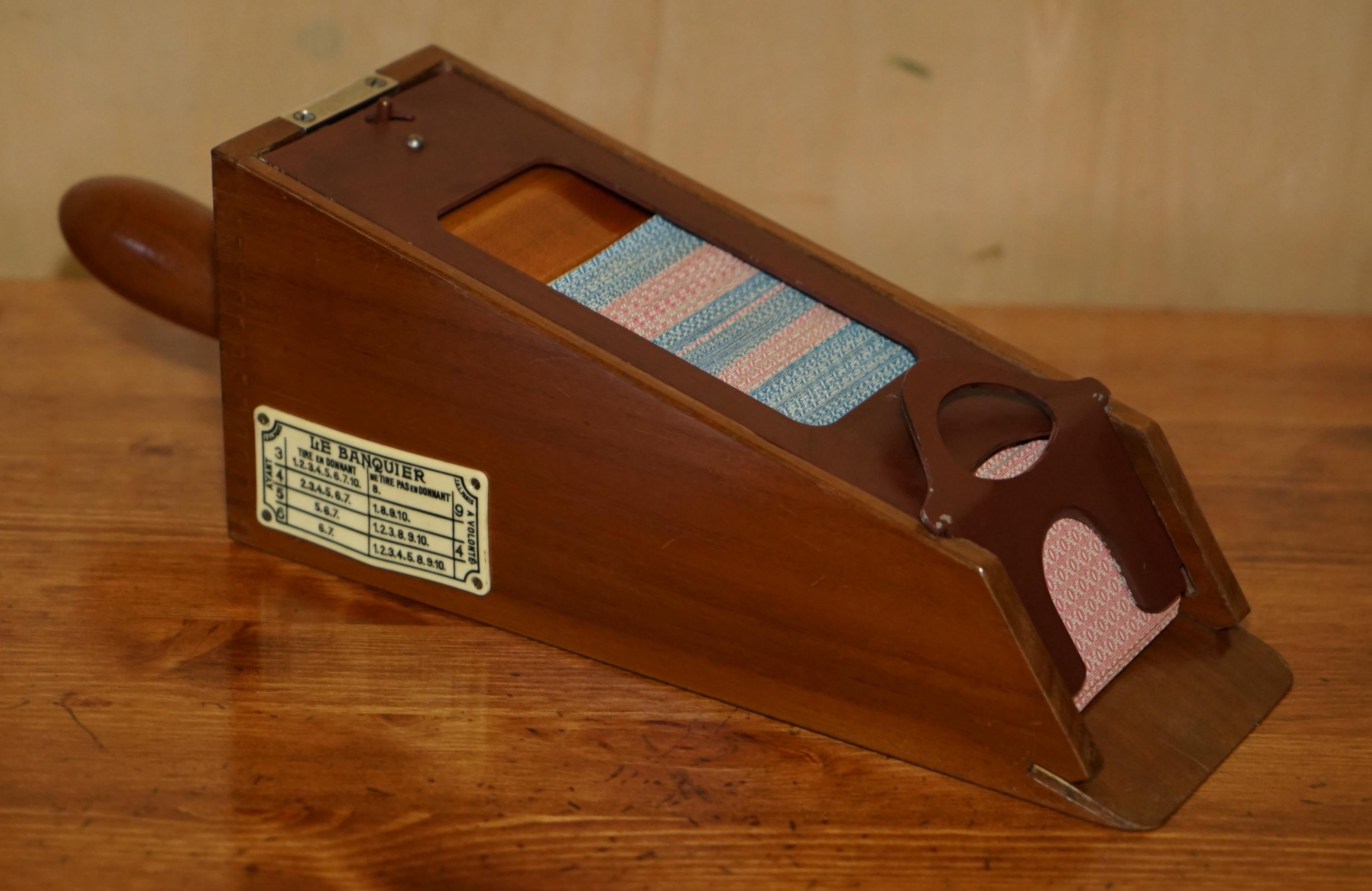 Royal House Antiques

Royal House Antiques is delighted to offer for sale this absolutely stunning, New Old Stock & Boxed Le Banquier Baccarat card dispenser with silver leaf tipped cards 

What can I say, if you are in the market for something to