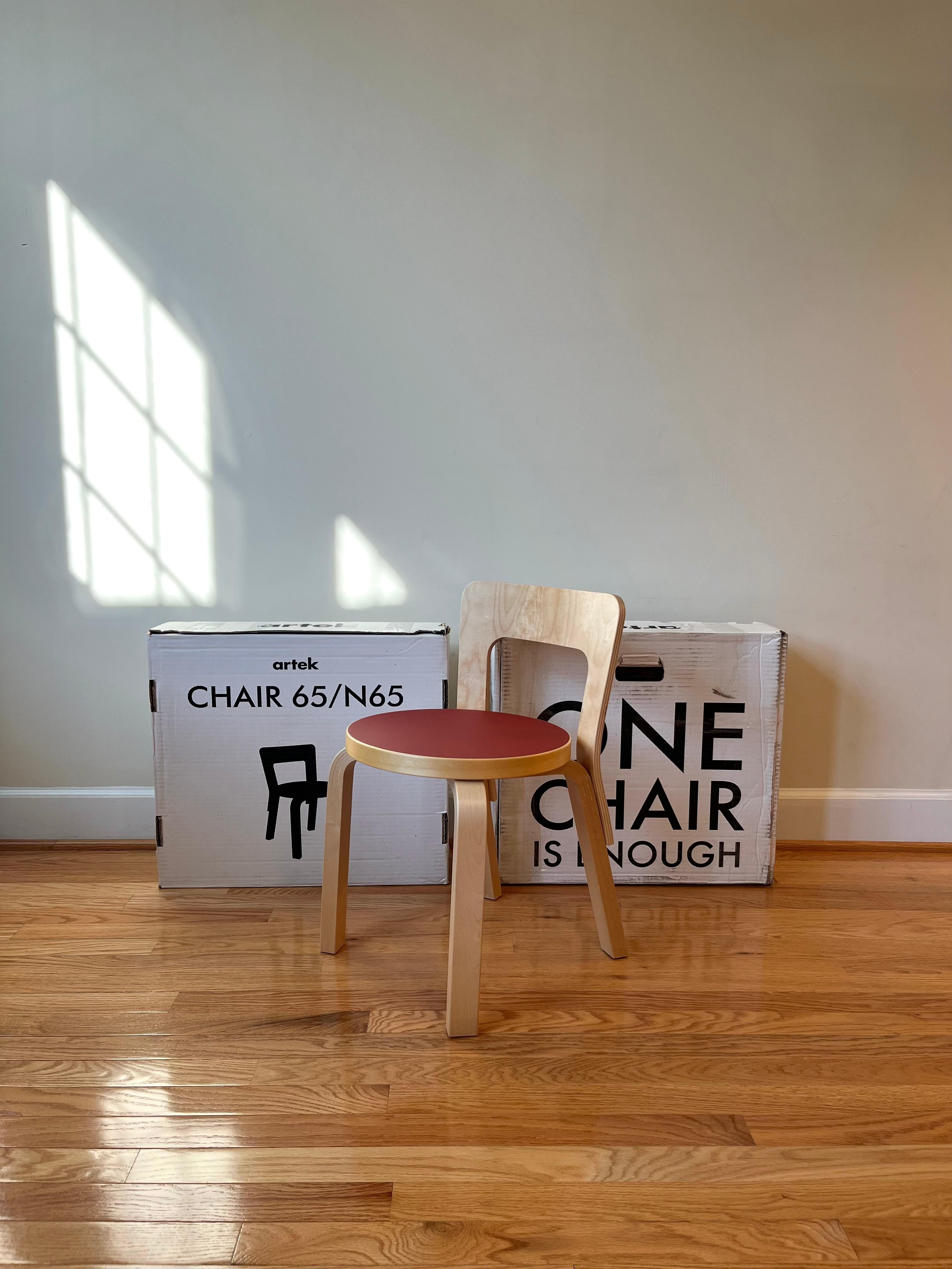 Chair N65 boasts clean lines and a simple, elemental structure. The chair models a low rectangular backrest formed from a single piece of birch plywood. 
Since the backrest follows a slight curve, it forms naturally to the back, offering comfort and