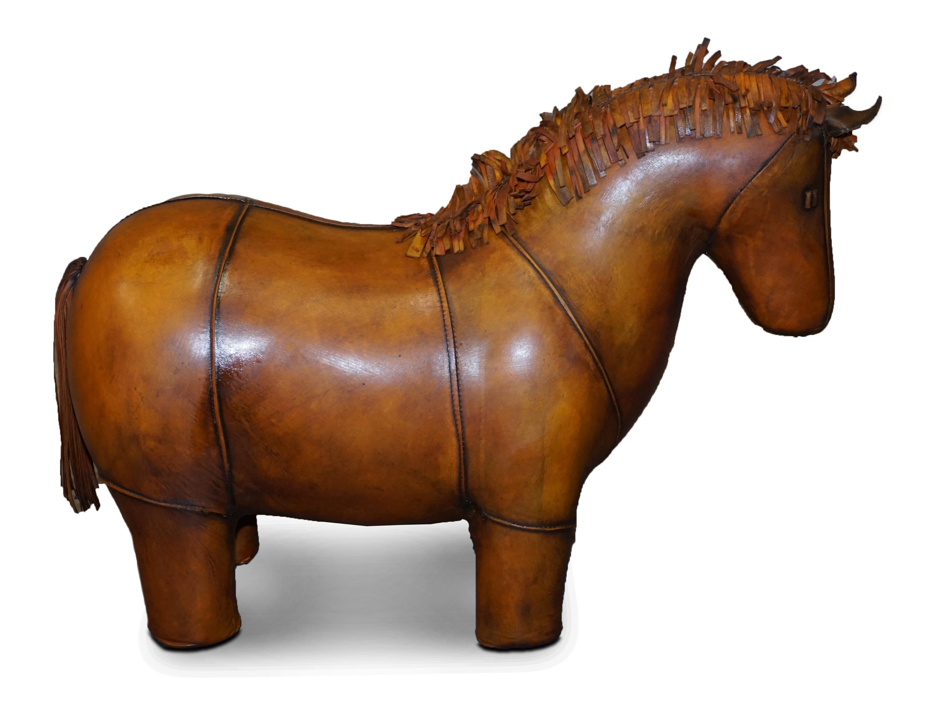 We are delighted to offer for sale this absolutely sublime new old stock original Liberty’s London Omersa style brown leather land dyed pony footstool

These come in varying sizes there is a quite unpractical extra large size which is around a