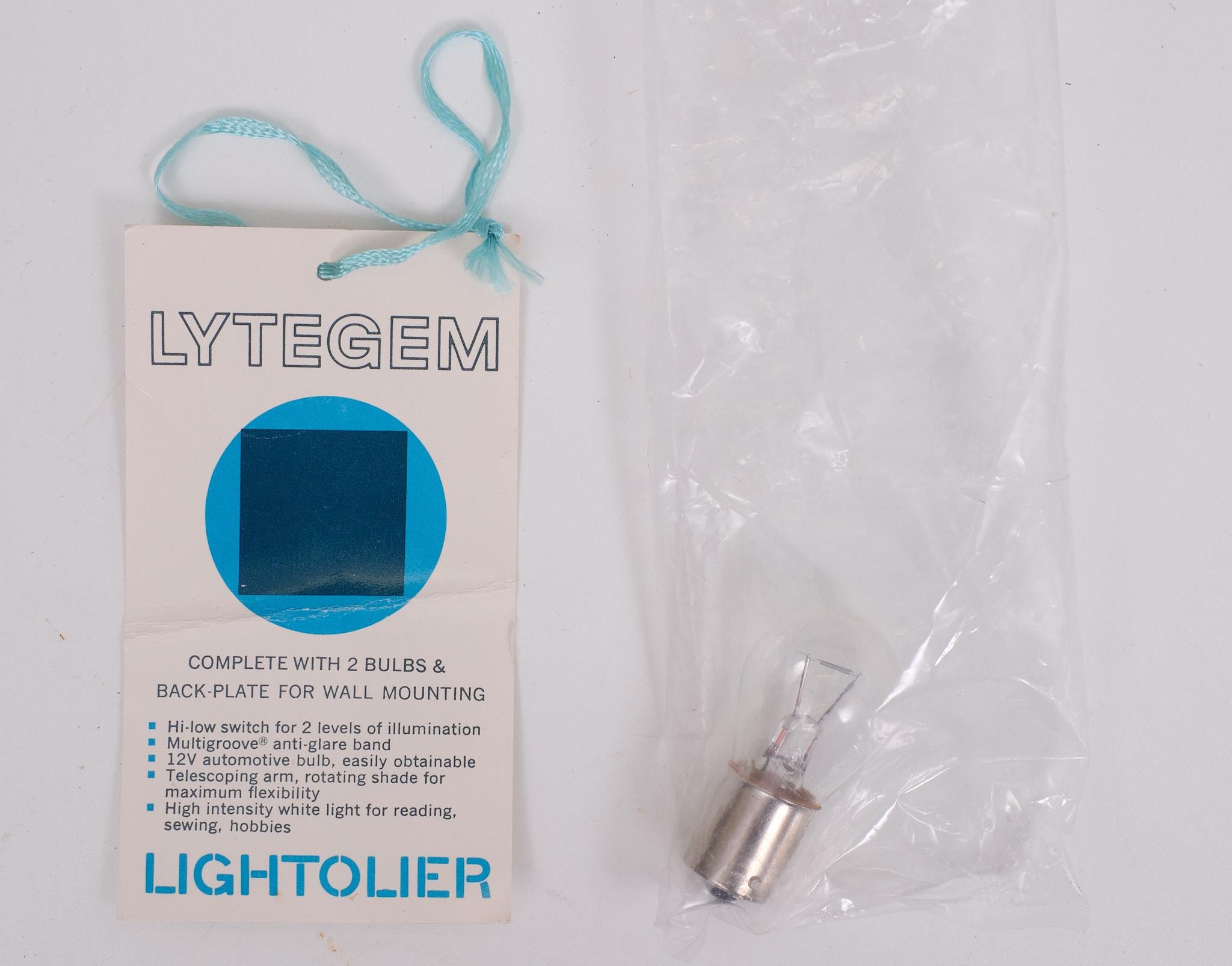 
New old stock   .Lytegem lamp in off-white with Black, cube base and chrome arm. Designed by Michael Lax for Lightolier. USA, circa 1990.Michael Lax (Designer),Lightolier (Maker) Light intensity can be changed from low to high via a switch located