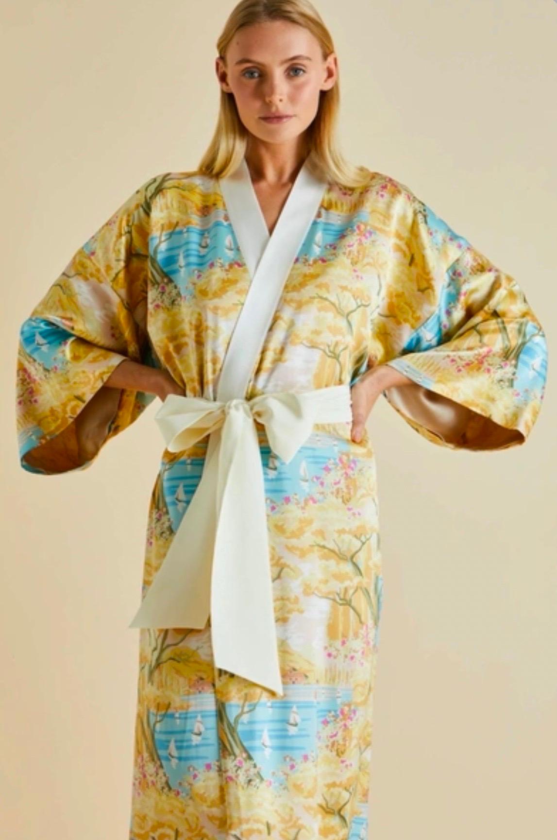 Olivia von Halle's robe is cut from soft silk-satin in a kimono-inspired silhouette. It is is printed all-over with a delicate design of a costal landscape. It features wide kimono sleeves. Wear yours while lounging around the house or over a dress