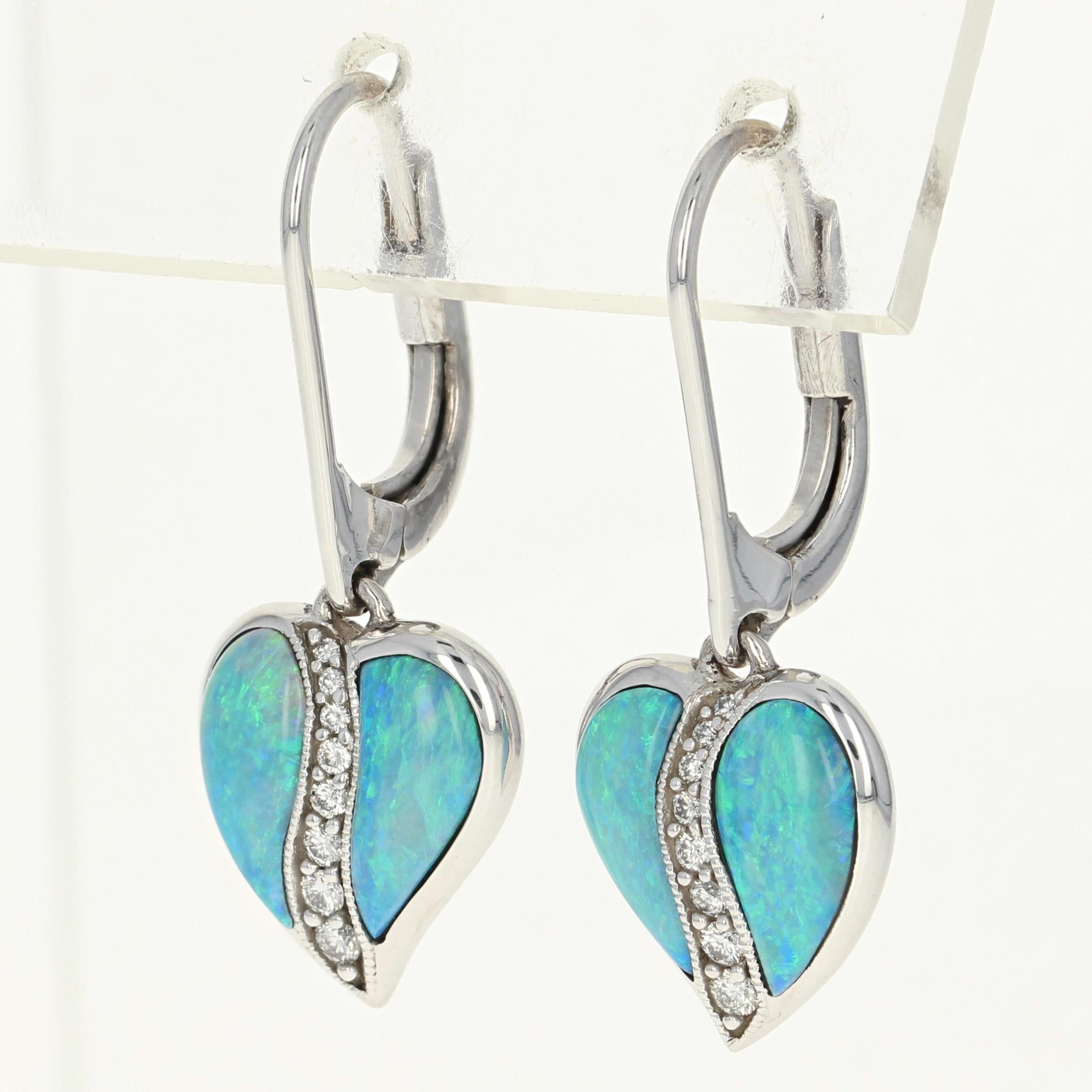 Add a vivacious splash of color and shine to your wardrobe with this fabulous NEW pair of gemstone earrings by Kabana! Composed of glistening 14k white gold, these earrings showcase a graceful leaf design adorned with radiant opals. A graduated row