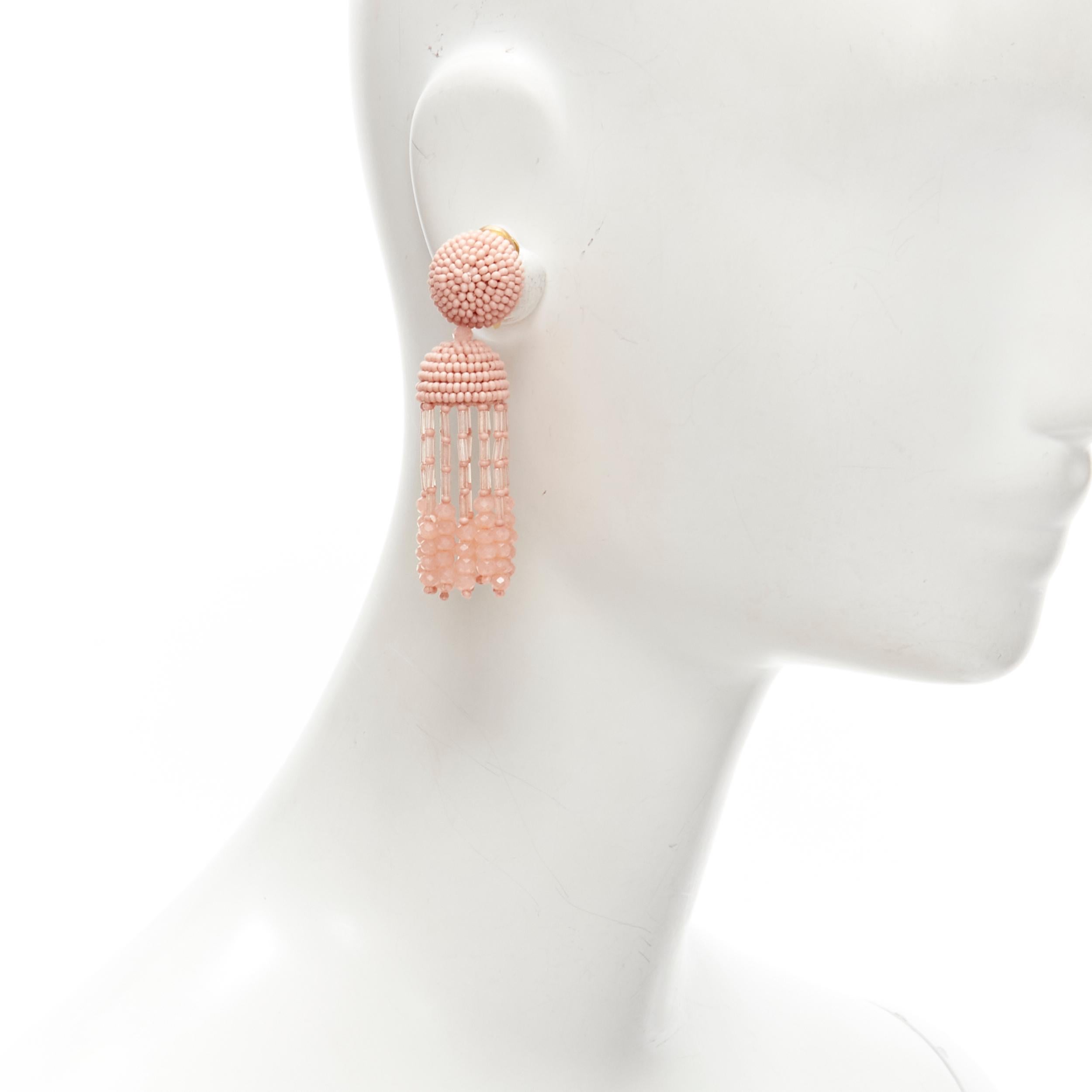 new OSCAR DE LA RENTA Signature pink bead embellished tassel clip on earrings 
Reference: TGAS/C01307 
Brand: Oscar De La Renta 
Material: Beaded 
Color: Pink 
Pattern: Solid 
Closure: Clip On 
Extra Detail: Tassel bead embellishment.
Estimated