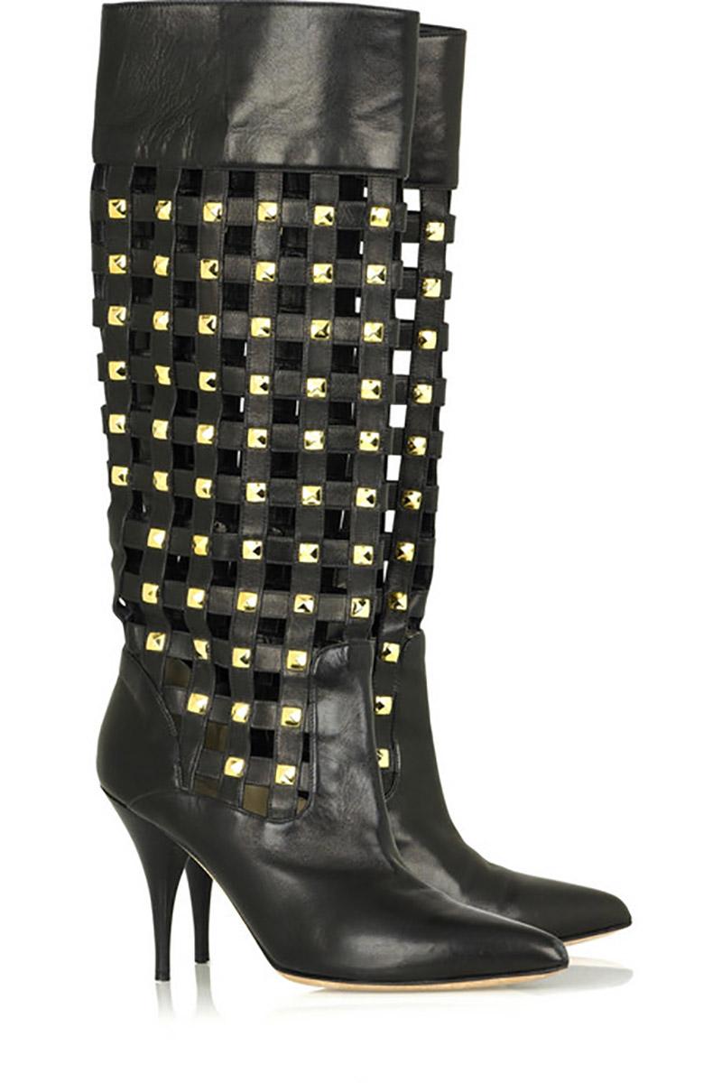OSCAR DE LA RENTA BOOTS

Toughen up ladylike looks with Oscar de la Renta's black leather checker studded knee-high boots.

Oscar de la Renta boots have a latticed effect with gold-tone stud detailing, pointed toe, leather sole and simply pull on.