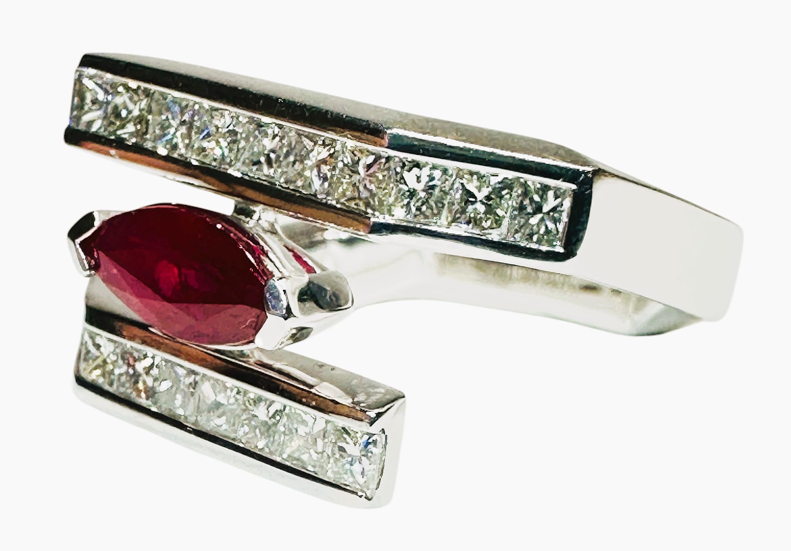 This is a rare and unique design by Oscar Friedman.  His designs are known and coveted throughout the world.  This ring is new with a tag and has 20 Square cut measuring 2 x 2 mm totaling .99 Carats.  The diamonds are VS1-VS2 and G-H in color.  The