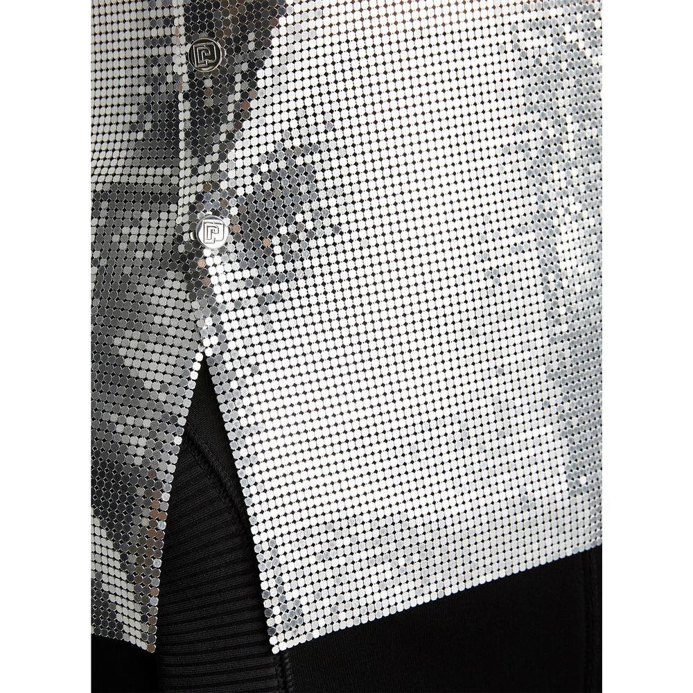 Detailed with logo-engraved snaps, Paco Rabanne's sleeveless top is composed of polished silvertone metal mesh. The shimmering material is a celebrated signature of the label.
Scoopneck. Logo-etched silvertone snaps.
Snap closure at