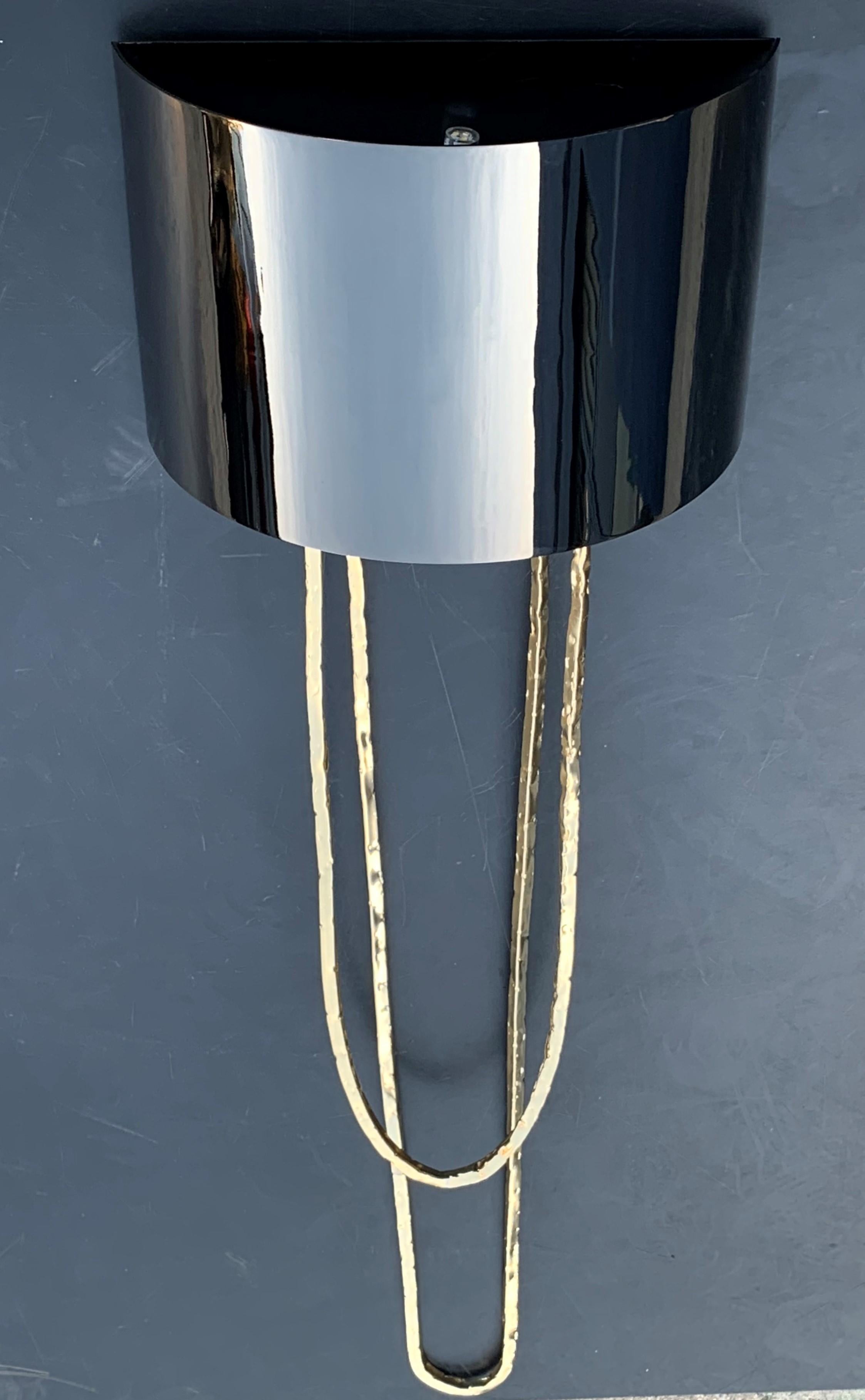 New pair of metal gold sconces with metal black chromed shade.