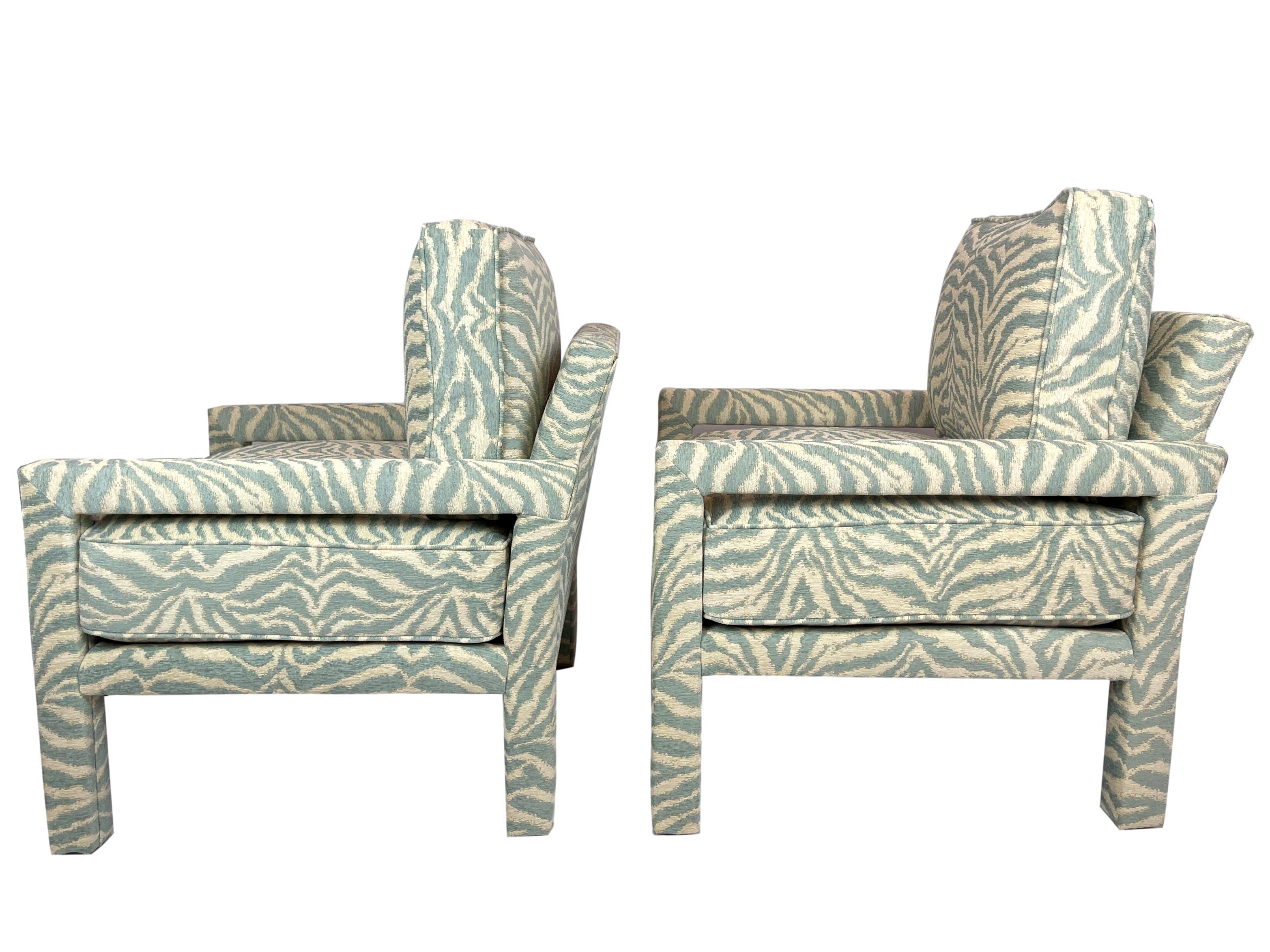 Pair of new Milo Baughman style parsons chairs upholstered in high-end designer zebra fabric.
Our chairs are handcrafted and upholstered from new materials and new fabric by the best craftsmen and artisans in Morganton, North Carolina, the high-end