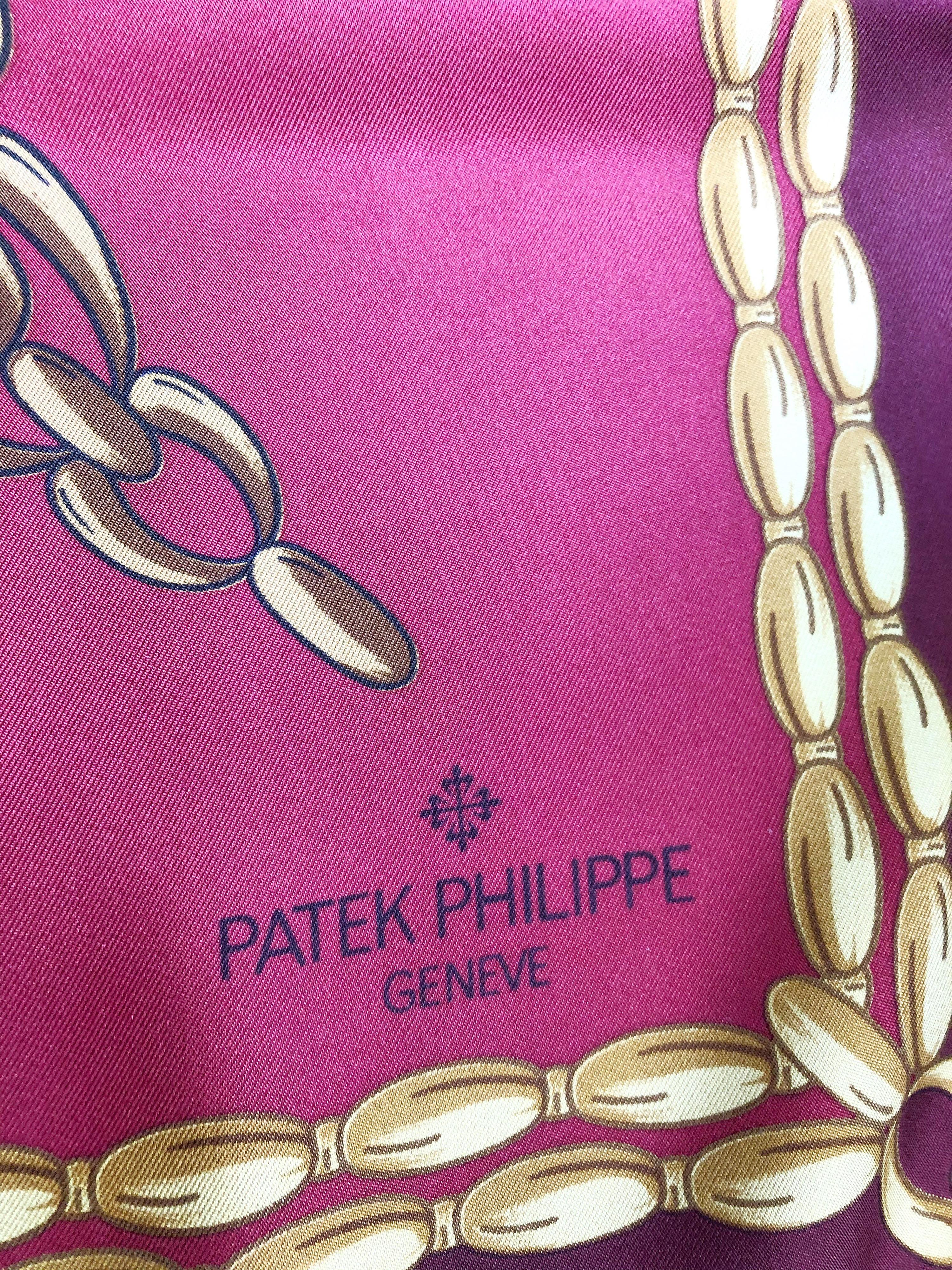 New never worn 90s PATEK PHILIPPE novelty watch print large silk scarf / shawl with original box ! Warm colors of red, green, blue, white and gold throughout. Signed at bottom left corner. Hand rolled edges. Never worn and comes with original box.