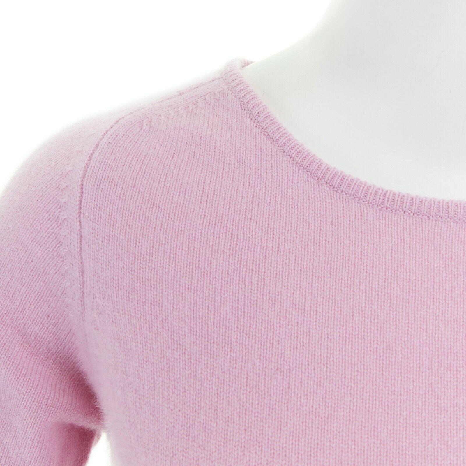 new PAULE KA 100% cashmere wool knit pastel pink short sleeve sweater top S
PAULE JA
100% cashmere. Pastel pink. 
Round neck. Short sleeves. 
Regular fit. Sweater top. 
Made in Hong Kong

CONDITION
New with tags.

SIZING
Designer size: S
Size