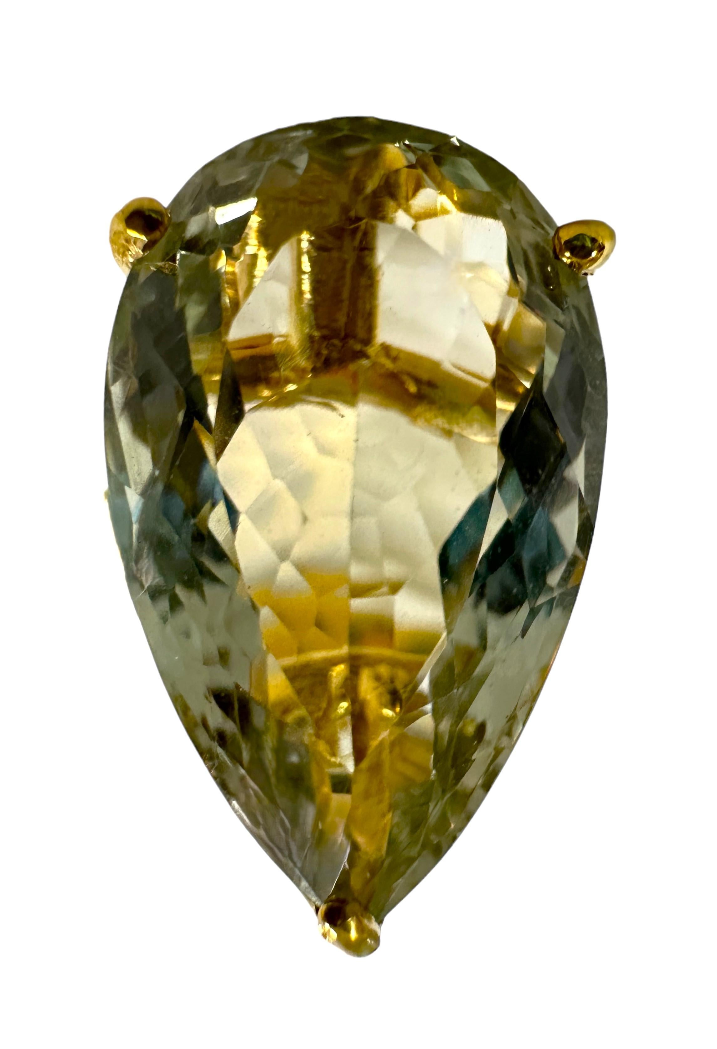 The ring is a size 7. This stone is from Africa.  It is a beautiful pear cut stone and is 18 cts.  It's a very high quality stone.  It measures 23 x 13 mm.   It is a beautiful ring and has a small pear cut green amethyst on either side of the stone.