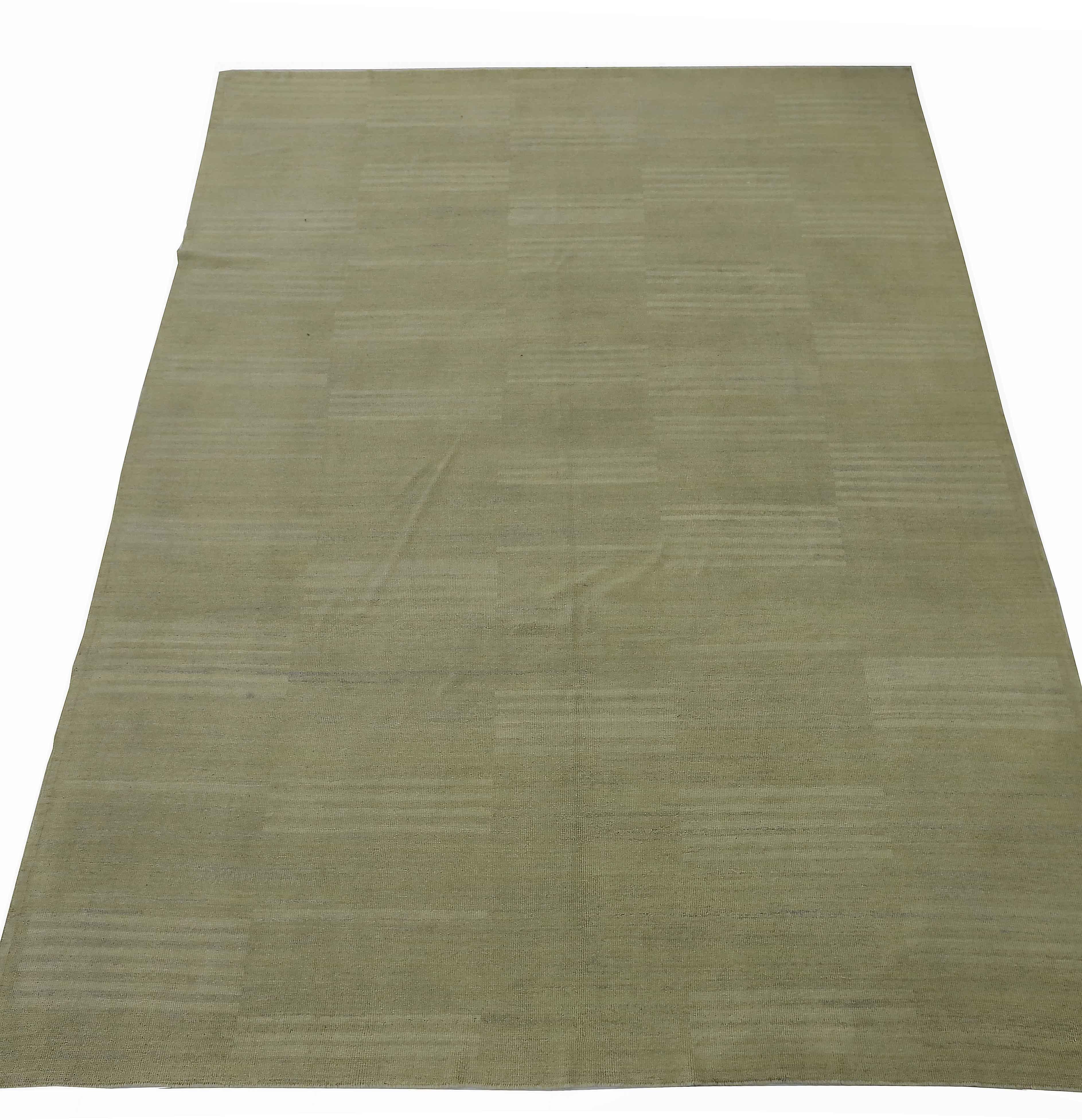 New Persian rug handwoven from the finest sheep’s wool and colored with all-natural vegetable dyes that are safe for humans and pets. It’s a traditional Kilim flat-weave design featuring modern ivory stripes on a green field. It’s a stunning piece
