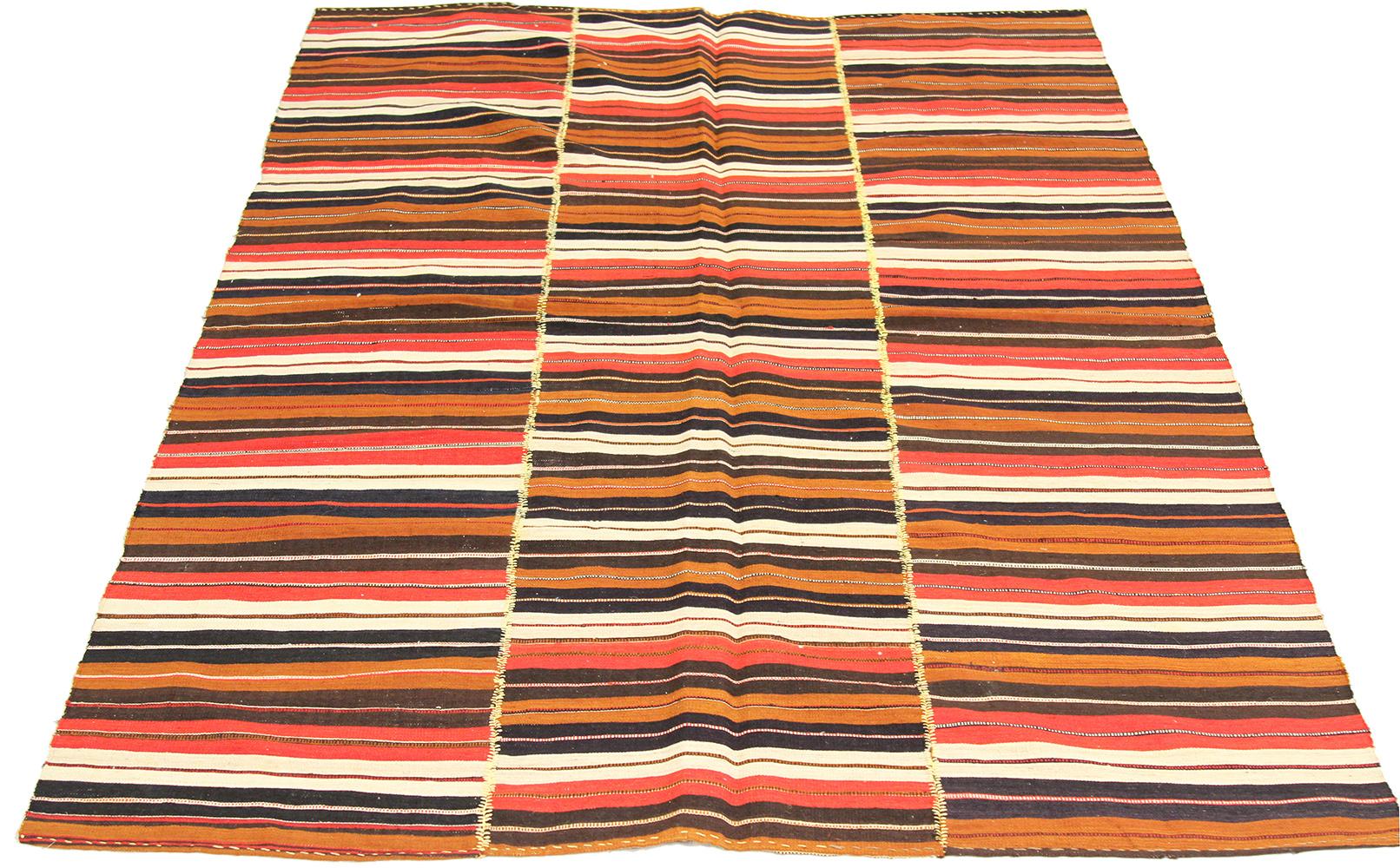 Persian rug handwoven from the finest sheep’s wool and colored with all-natural vegetable dyes that are safe for humans and pets. It’s a Kilim style flat-weave design featuring striking stripes in red, black, and brown over an ivory field. It’s a