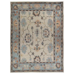 New Persian Oushak Style Rug with Black and Blue Floral Details on Ivory Field