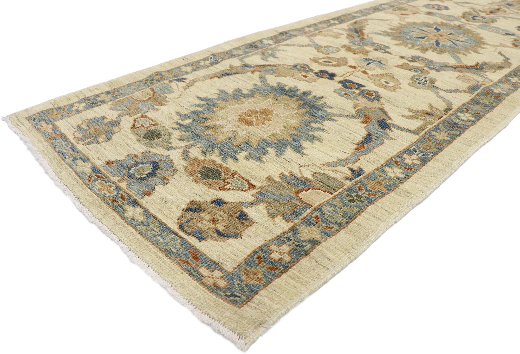 60914 New Contemporary Persian Style Sultanabad Runner with Modern Style 03'01 x 14'00. This hand-knotted wool contemporary Persian Style Sultanabad carpet runner features an all-over botanical pattern spread across an abrashed sandy-beige field. An