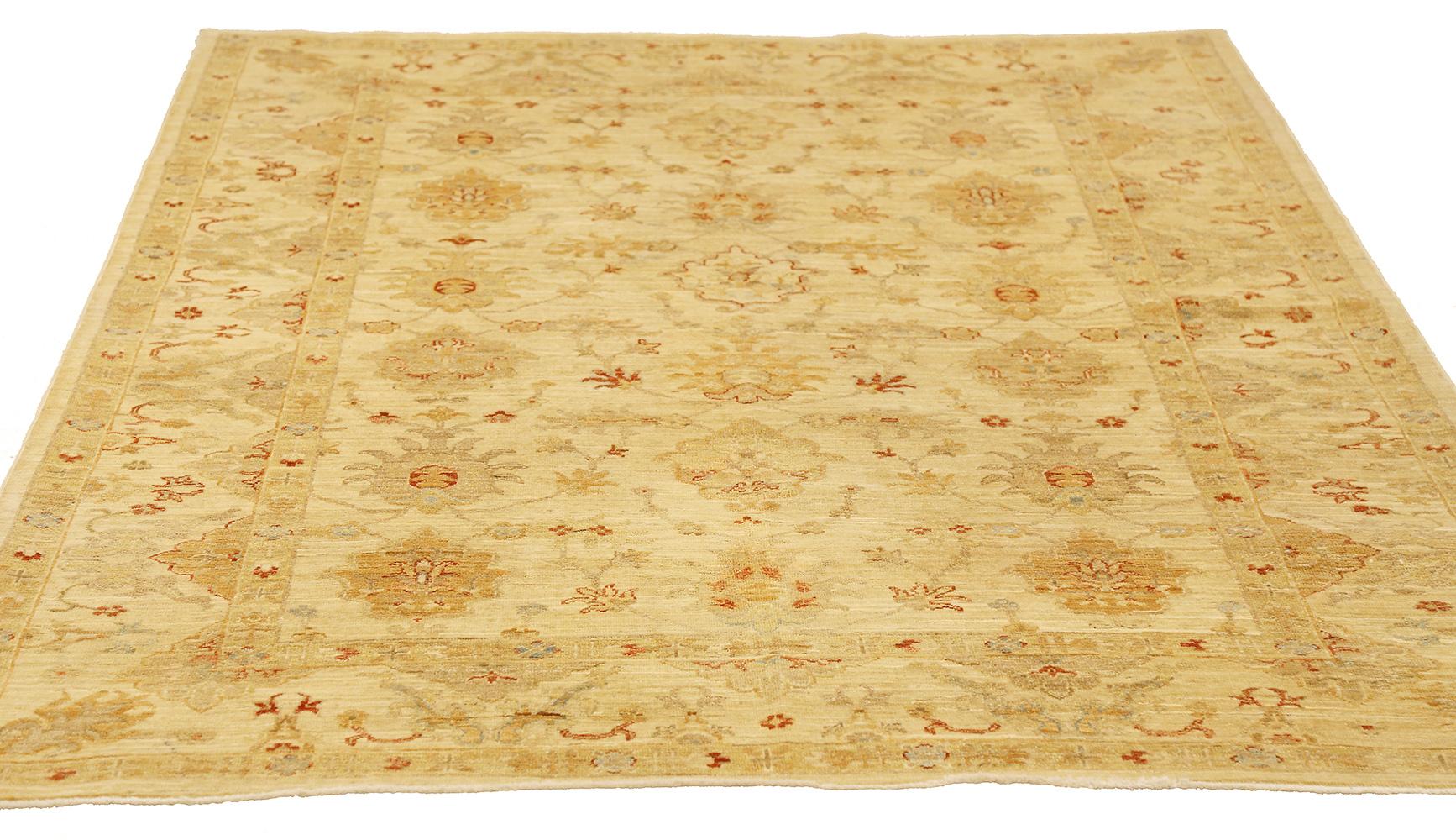 New Persian rug handwoven from the finest sheep’s wool and colored with all-natural vegetable dyes that are safe for humans and pets. It’s a traditional Tabriz weaving featuring a lovely and extraordinary ensemble of floral designs over an ivory