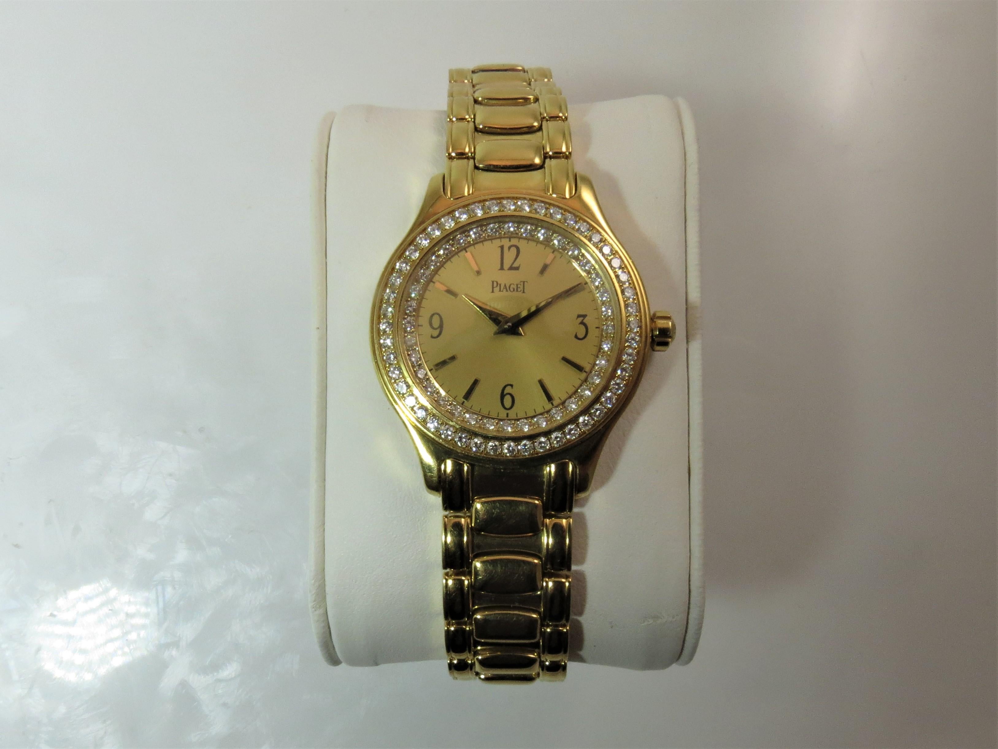 Brand new, never worn 18K yellow gold Piaget bracelet watch, with double row diamond bezel, quartz movement, gilt dial, case size 27mm, Style 01G0A21166, Serial #646676, Case Back 5805M201, 7.5 inches long.
Last retail $23,750