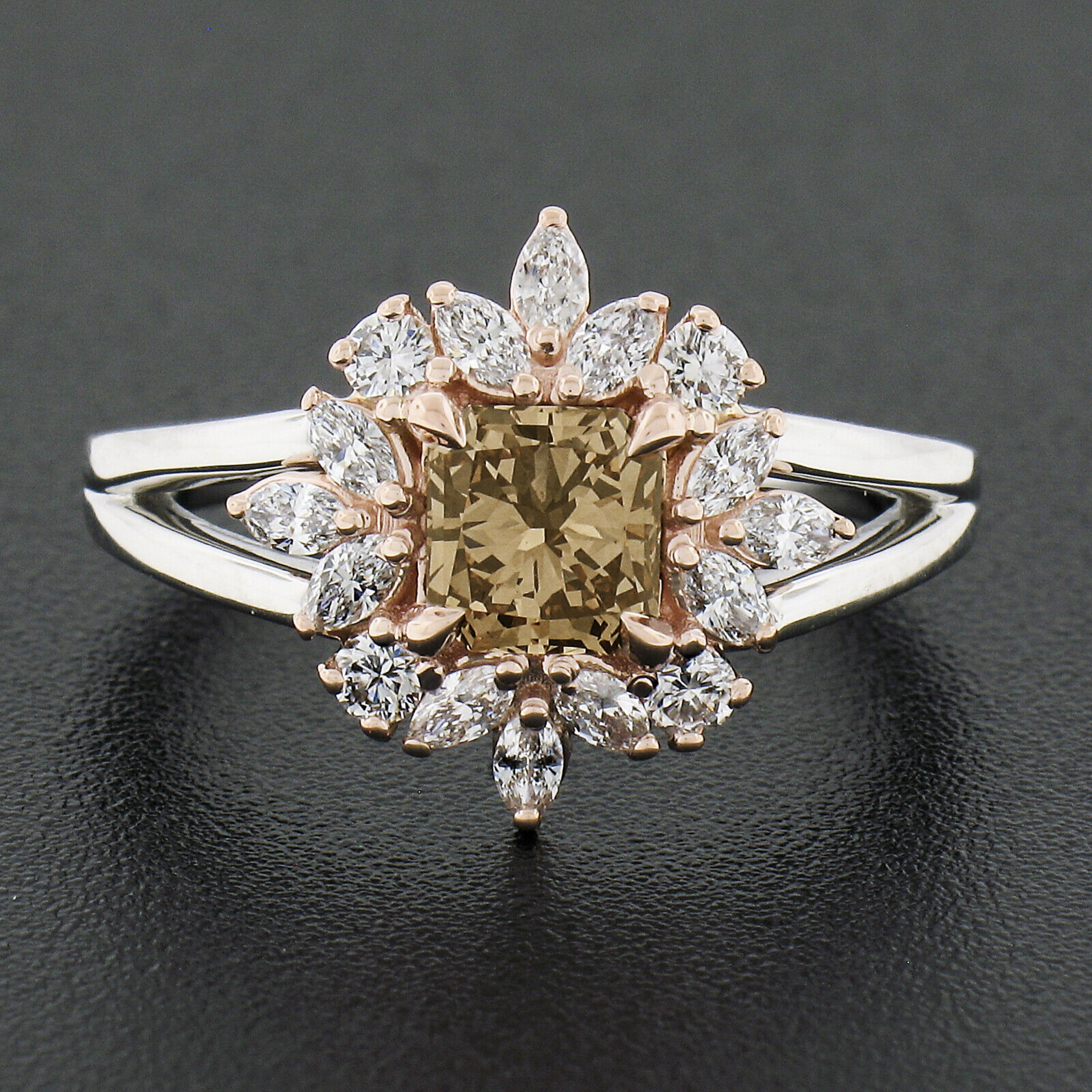 This gorgeous, custom made, diamond ring is newly crafted in solid platinum with a 14k rose gold top and features an amazing, 0.78 carat, GIA certified radiant cut diamond neatly prong set at its center. This incredible stone has natural, fancy dark