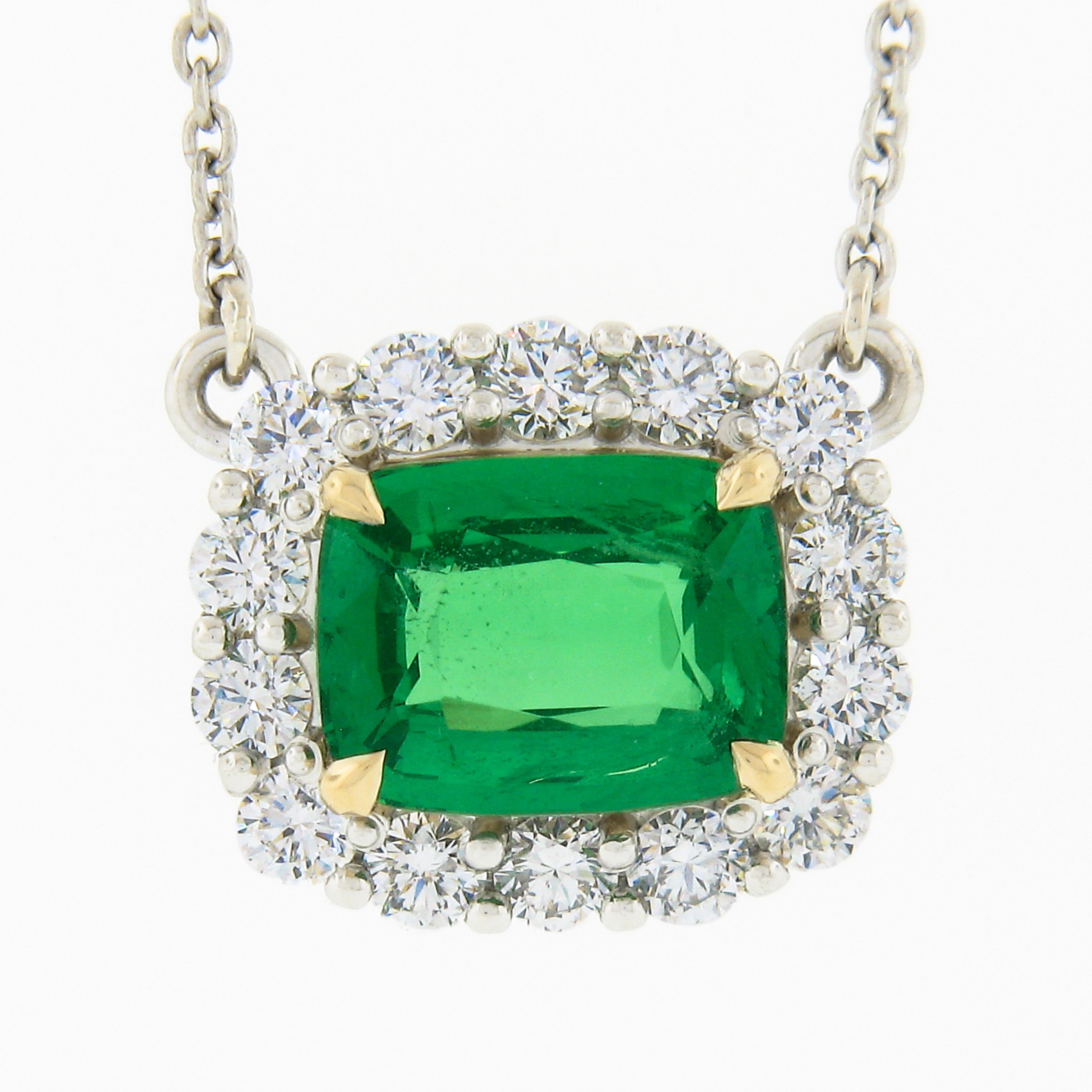 Here we have an absolutely gorgeous pendant necklace that is newly crafted from .950 platinum with a solid 18k yellow gold center basket that carries a stunning, GIA certified, natural tsavorite stone surrounded by a super fiery diamond halo. The