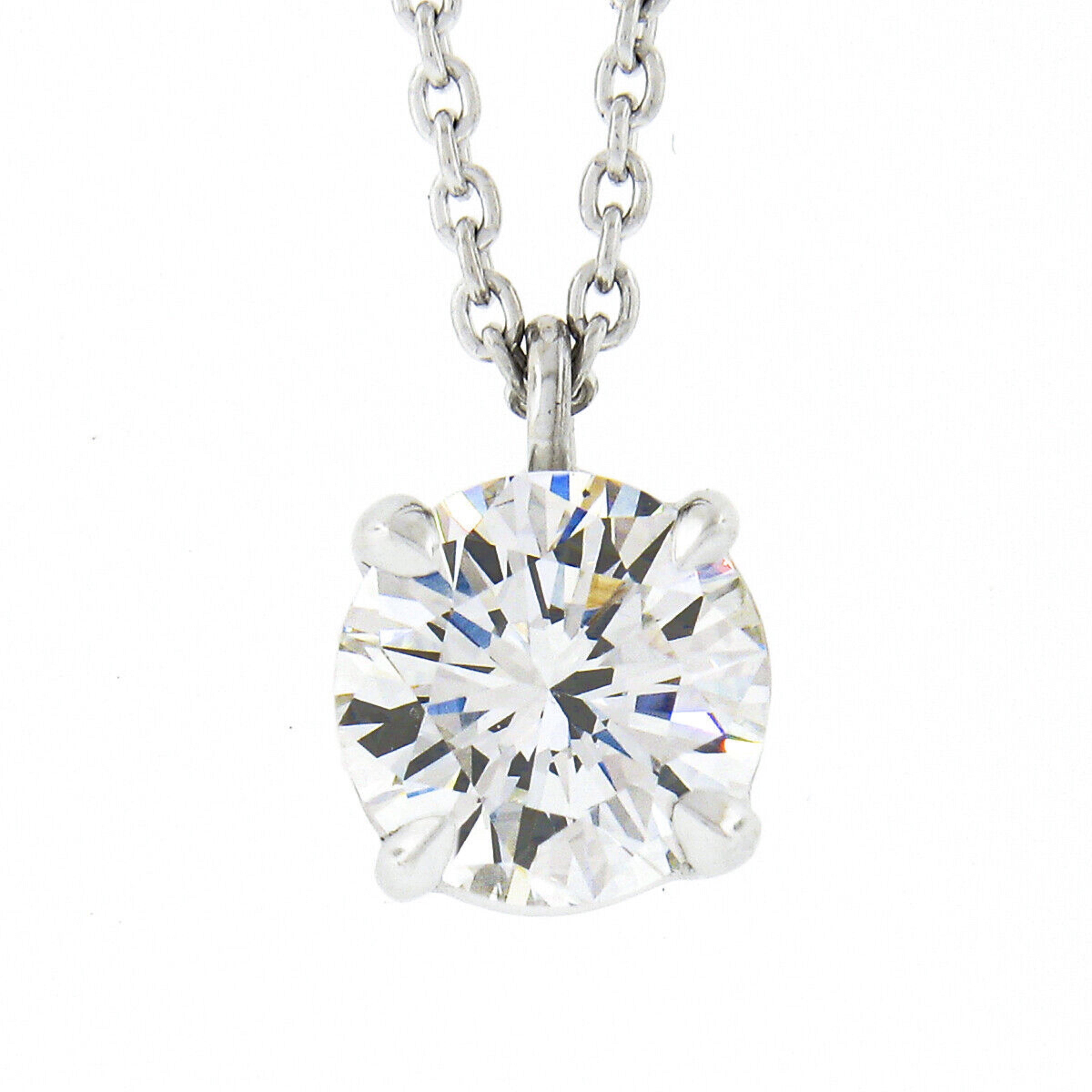 Here we have a gorgeous, brand new, diamond pendant necklace crafted in solid platinum. The necklace features a very fine quality, GIA certified, round brilliant cut diamond solitaire neatly claw-prong set at the center on an open basket setting.