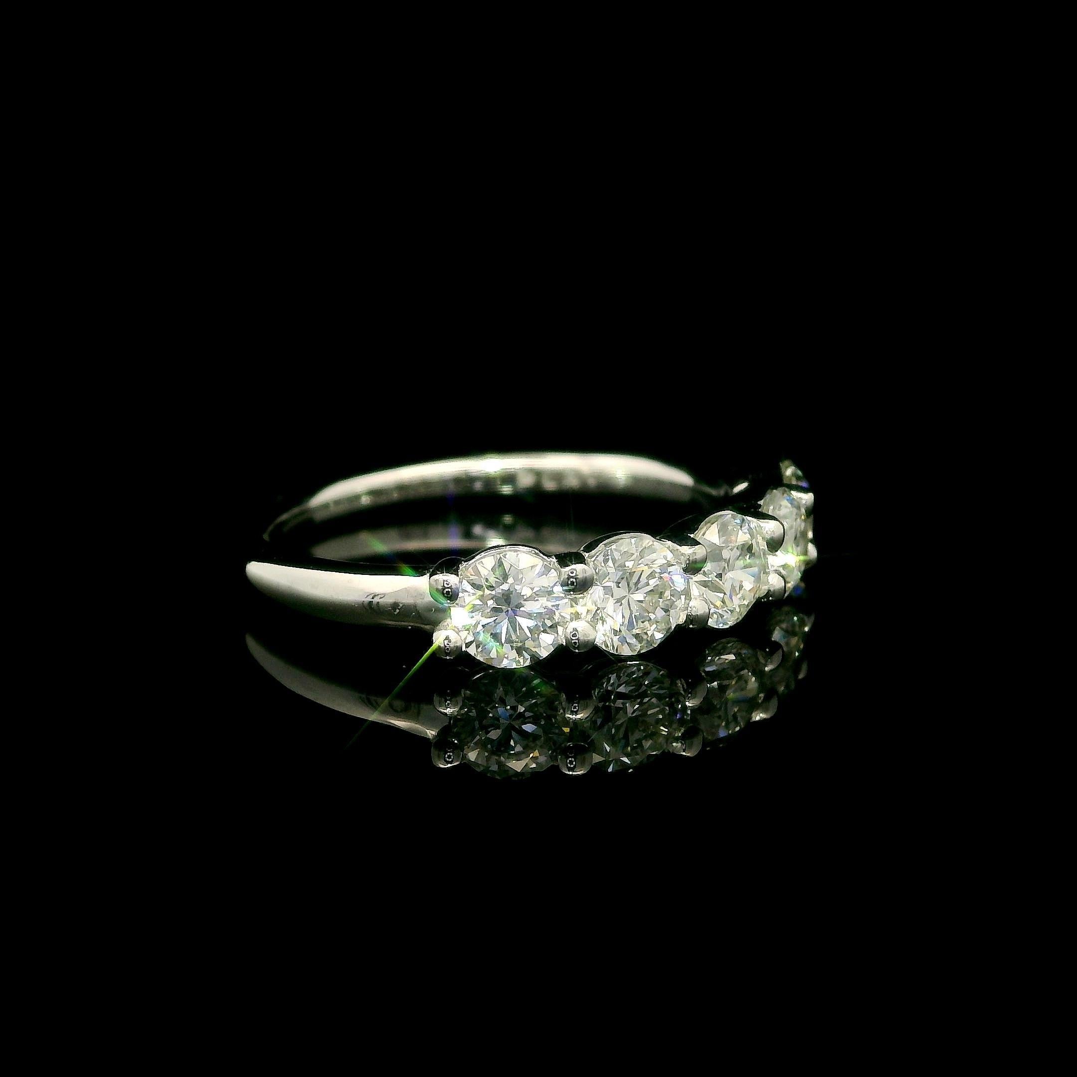 --Stone(s):--
(5) Natural Genuine Diamonds - Round Brilliant Cut - Shared Prong Set - VS1/VS2 Clarity - H Color - 1.24ctw (exact)
Total Carat Weight: 1.24 (exact)

Material: Solid .900+ Platinum
Weight: 4.62 Grams
Ring Size: 6.5 (Fitted on a finger,