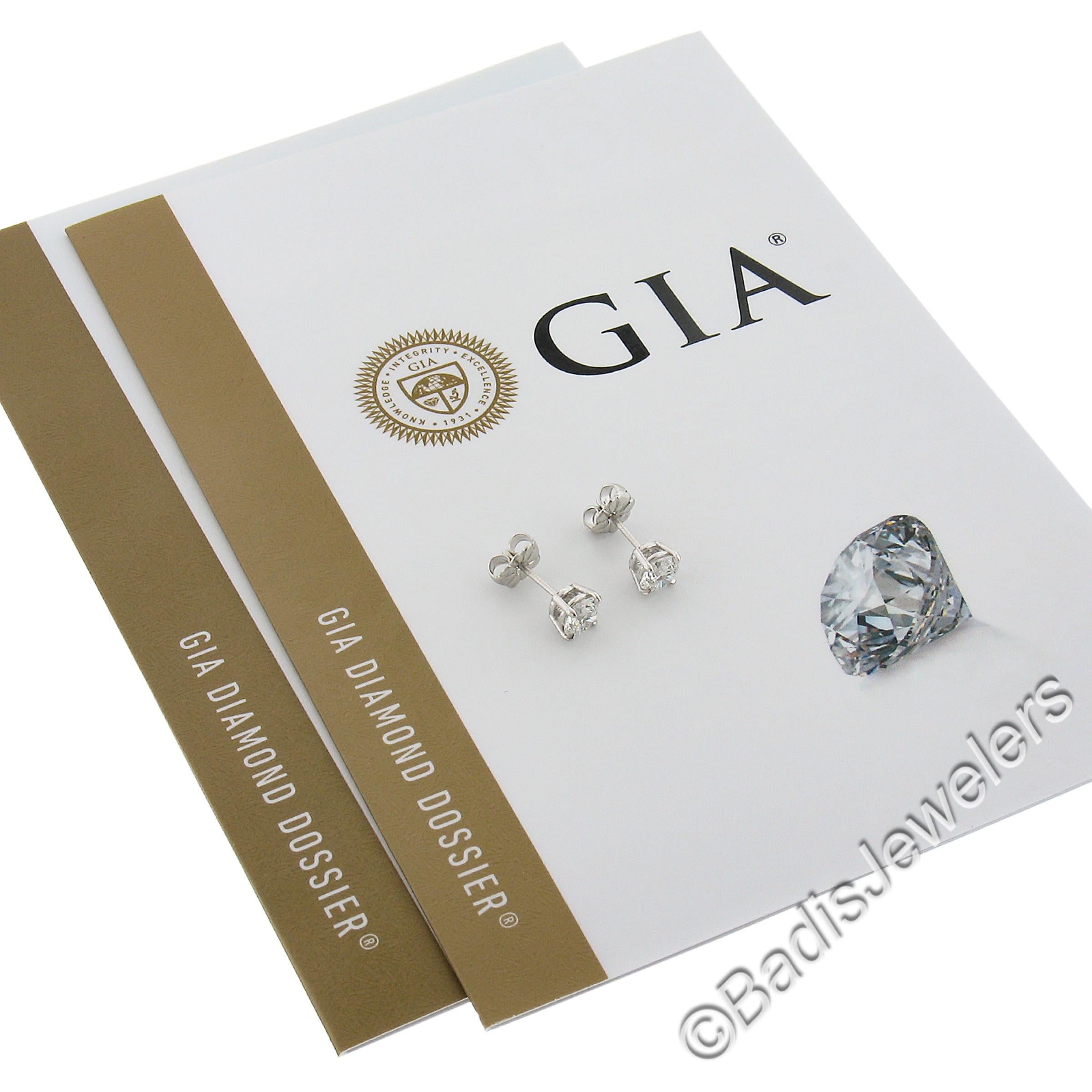--Stone(s):--
(2) Natural Genuine Diamonds - Round Brilliant Cut -  4-Prong Set - F Color - SI1 Clarity
**See Reports below**
Total Carat Weight:	1 (exact)

Material: Solid .900+ Platinum
Weight: 1.58 Grams
Backing: Post Backs w/ Sturdy Butterfly