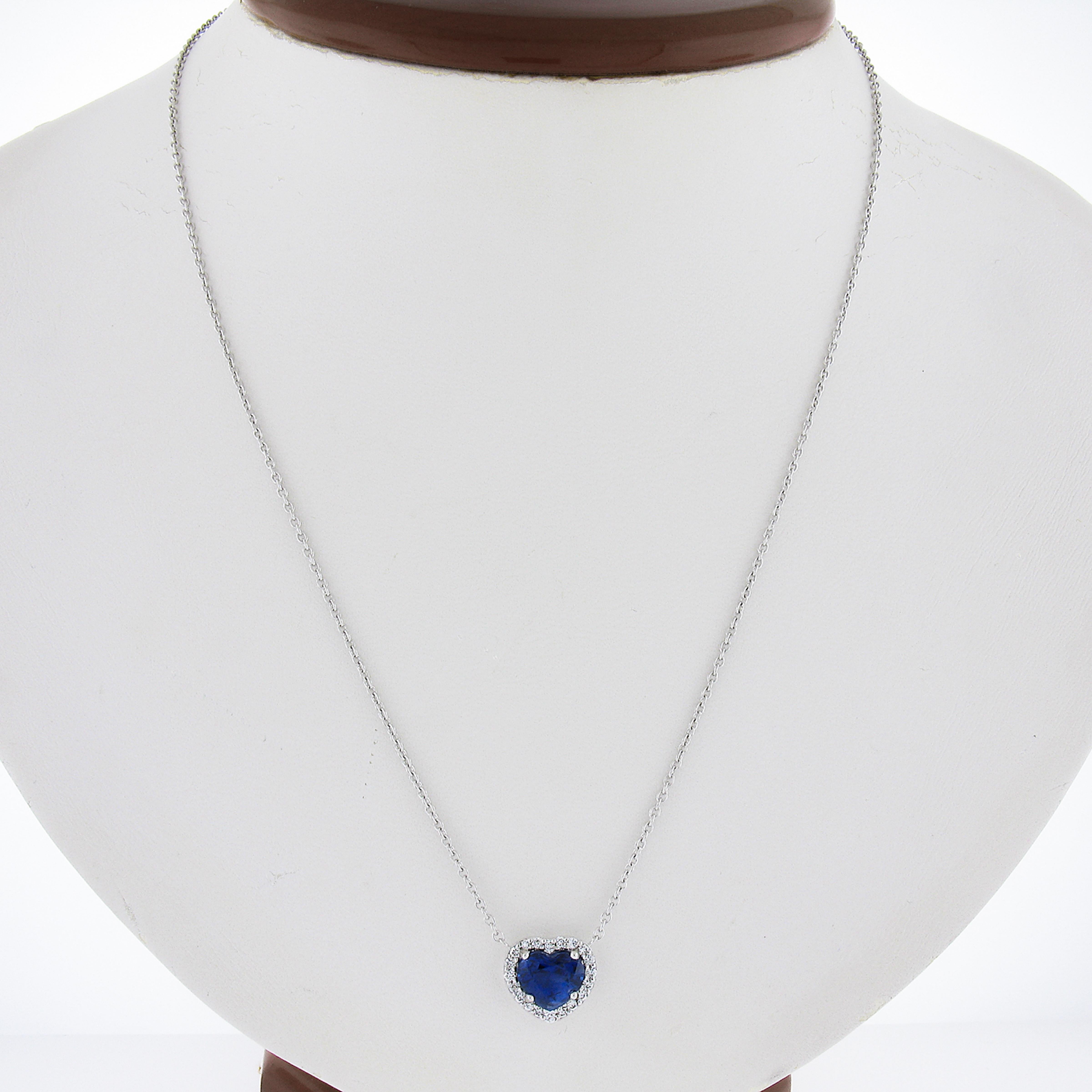 --Stone(s):--
(1) Natural Genuine Sapphire - Heart Brilliant Cut - Prong Set - Very Fine Rich Blue Color - 2.06ct (exact)
(20) Natural Genuine Diamonds - Round Brilliant Cut - Prong Set - F/G Color - VS1/VS2 Clarity - 0.21ctw (exact)
Total Carat