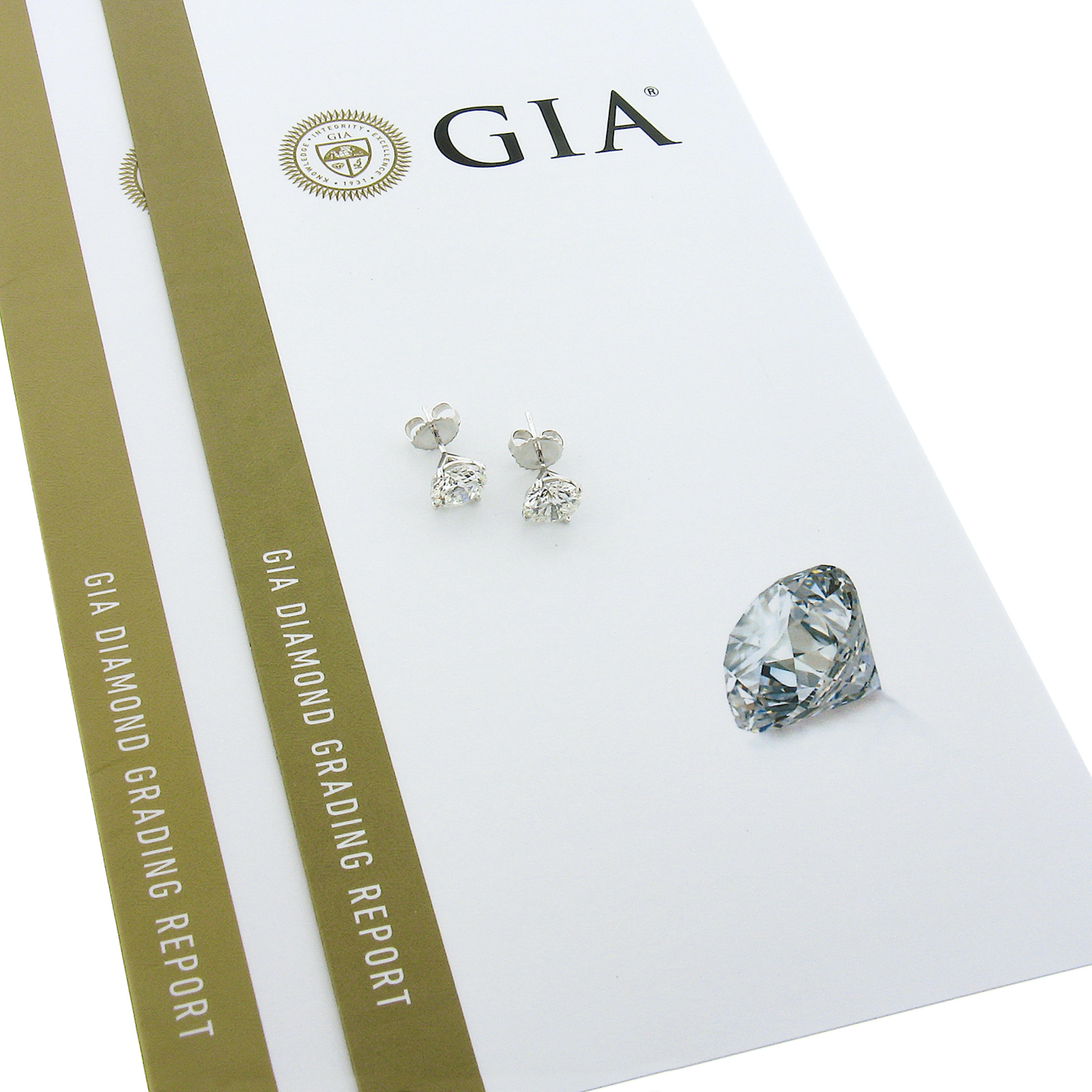 This stunning elegant pair of diamond stud earrings was newly crafted from solid platinum and features two brilliant and fiery, GIA certified, round martini prong set diamonds. These very fine quality diamonds total exactly 3.06 carats in weight.