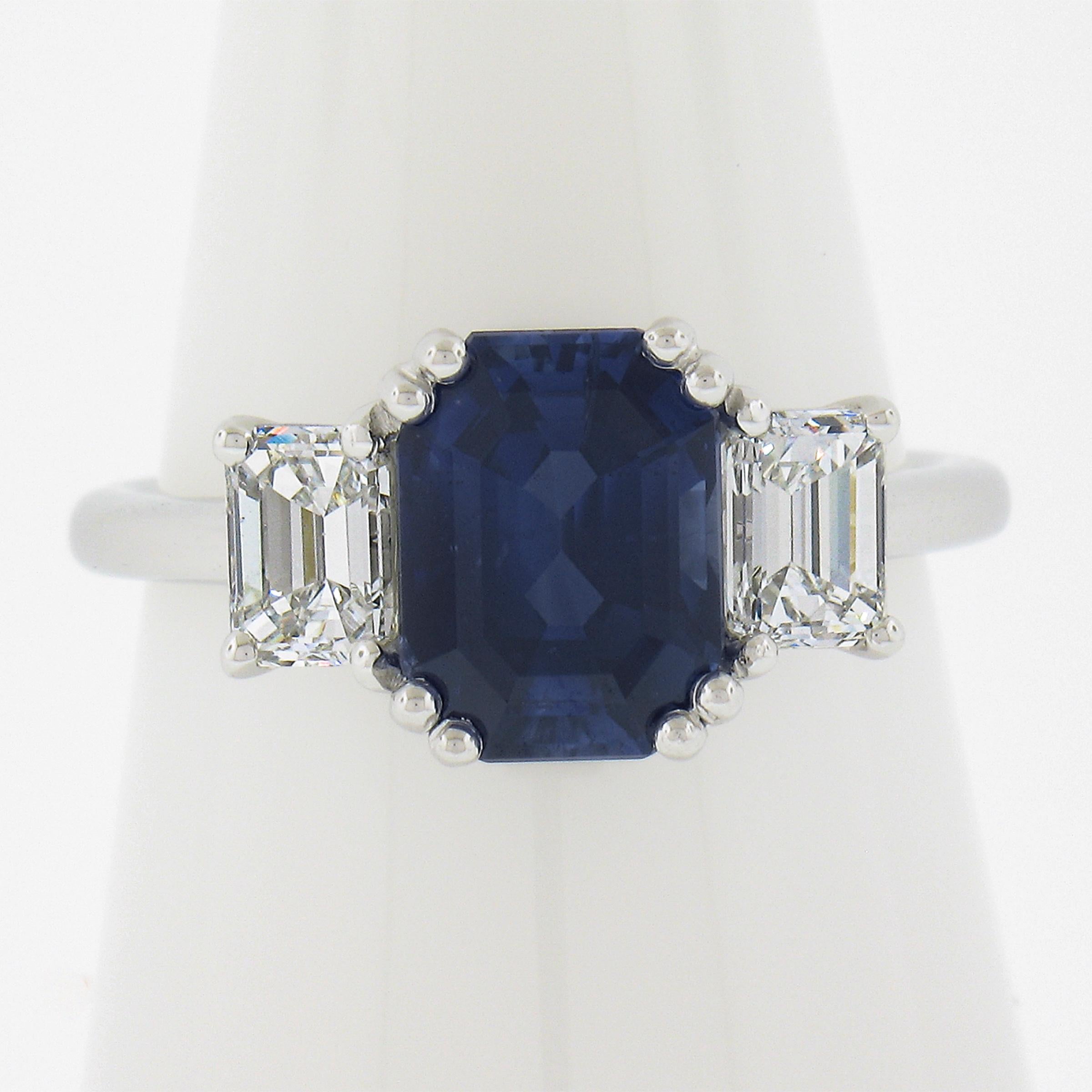 --Stone(s):--
(1) Natural Genuine Sapphire - Octagonal Cut - Prong Set - Royal Blue Color - Heated - 2.62ct (exact - certified)
** See Certification Details Below for Complete Info **
(2) Natural Genuine Diamonds - Emerald Cut - Prong Set - G/H
