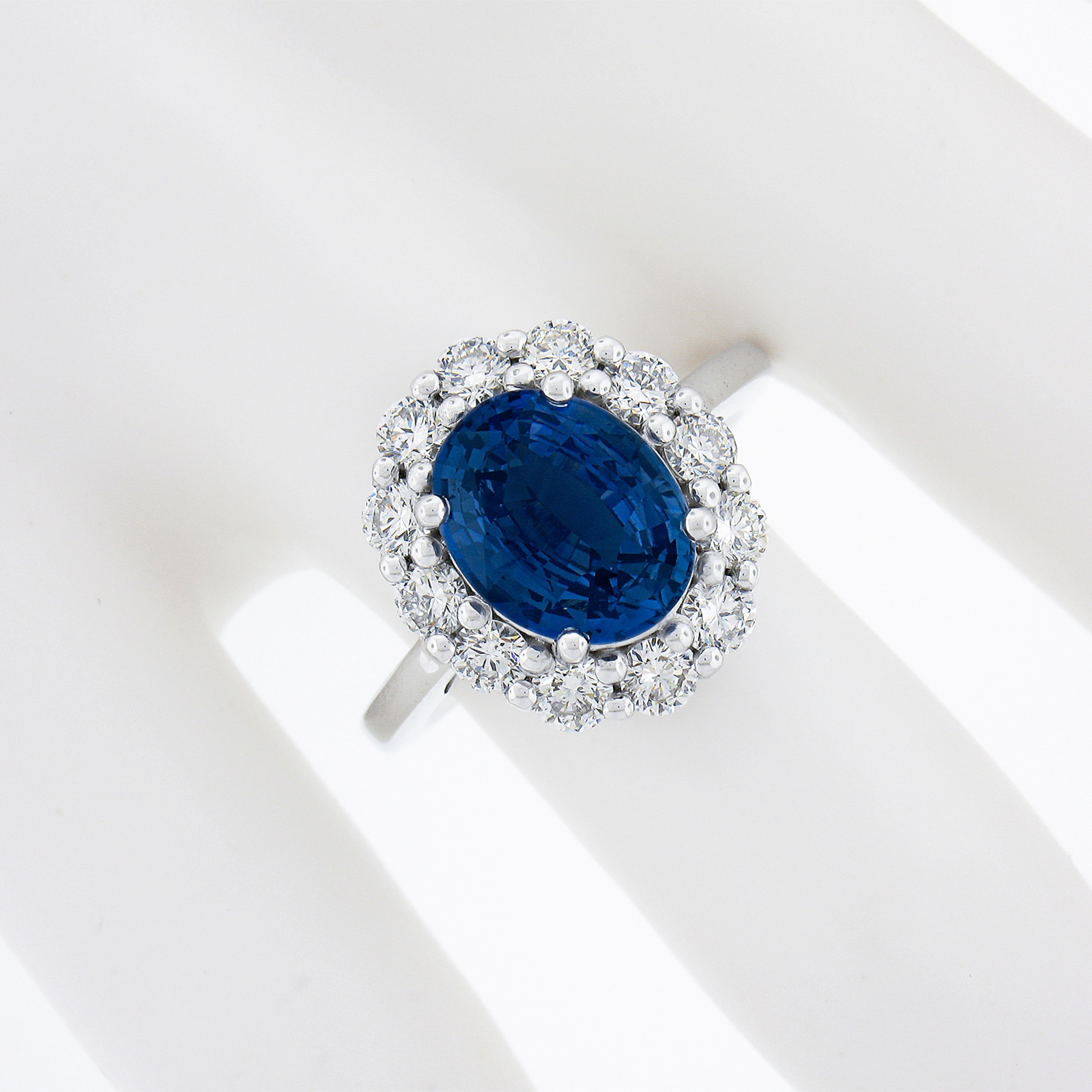 New Platinum 4.79ctw GIA No Heat Oval Blue Sapphire & Diamond Halo Cocktail Ring In New Condition For Sale In Montclair, NJ
