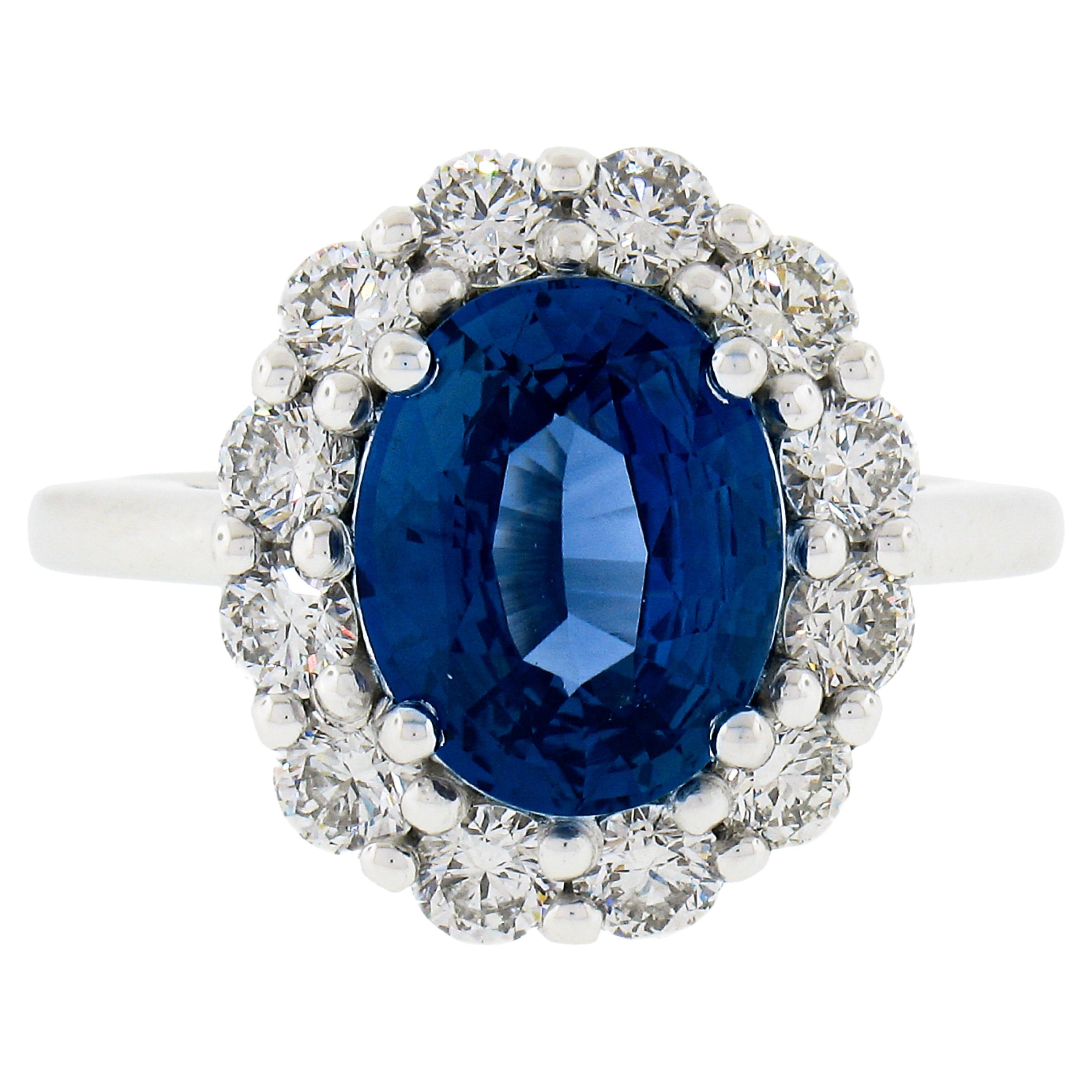 New Platinum 4.79ctw GIA No Heat Oval Blue Sapphire & Diamond Halo Cocktail Ring For Sale