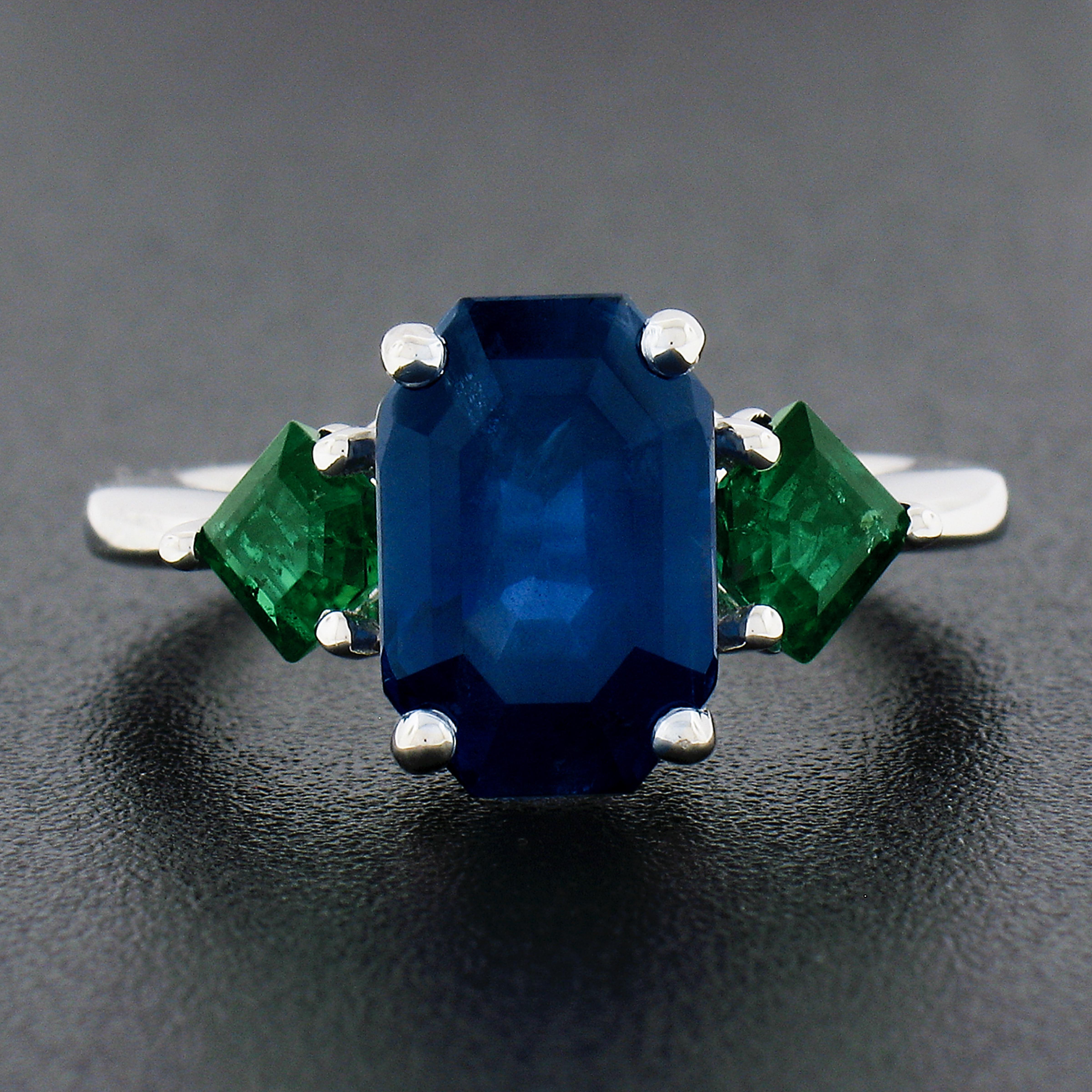 New Platinum 5.32ctw Gubelin Emerald Cut Sapphire & Custom Cut Emerald Ring In New Condition For Sale In Montclair, NJ