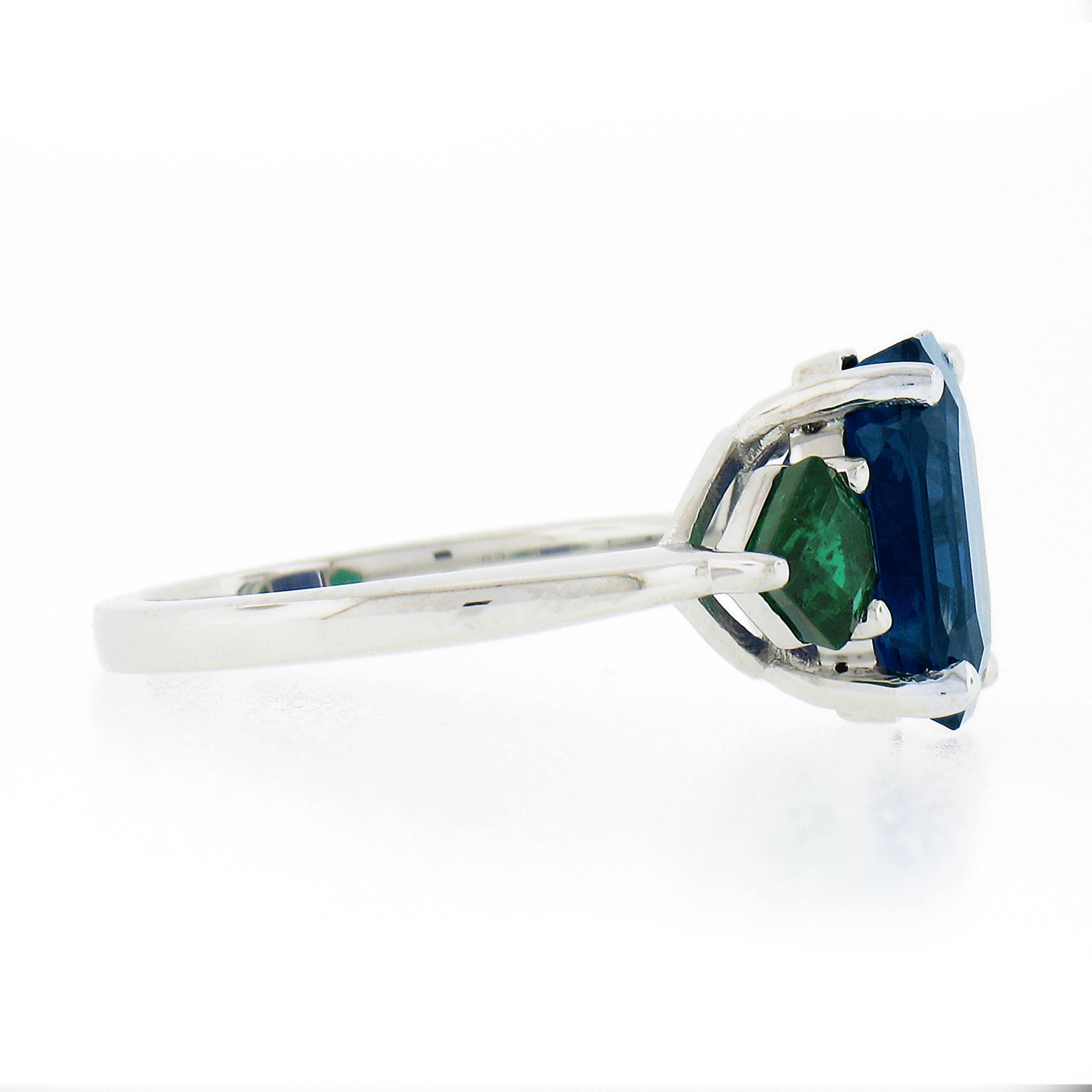 New Platinum 5.32ctw Gubelin Emerald Cut Sapphire & Custom Cut Emerald Ring For Sale 1