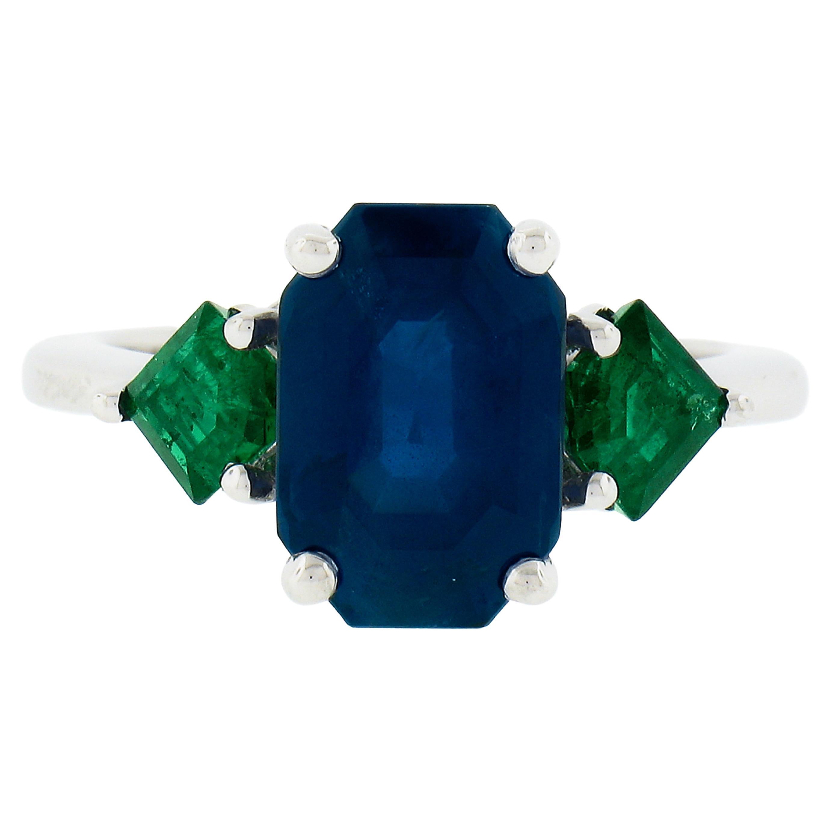 New Platinum 5.32ctw Gubelin Emerald Cut Sapphire & Custom Cut Emerald Ring For Sale