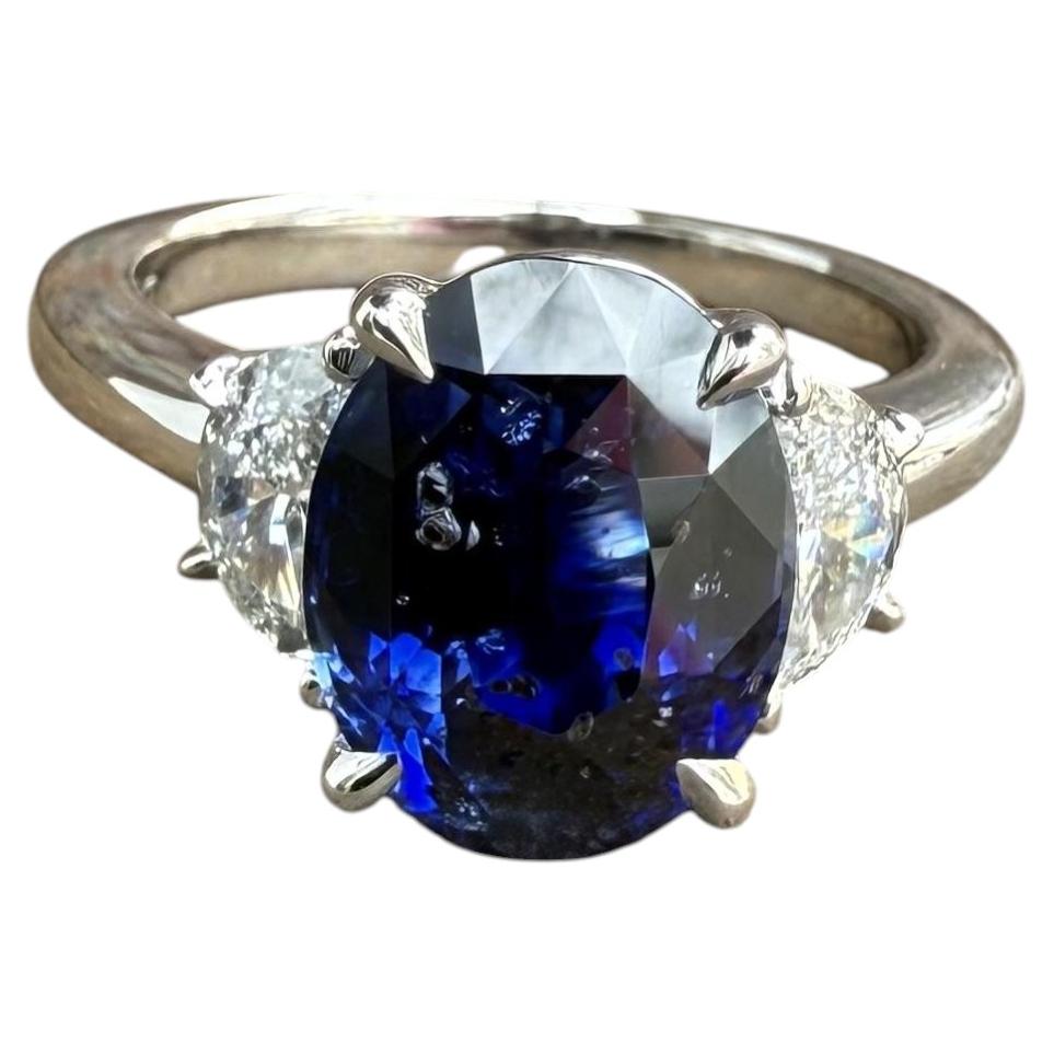 New Platinum 5.69ctw GIA Oval Step Cut No Heat Sapphire Half Moon Diamond Ring For Sale
