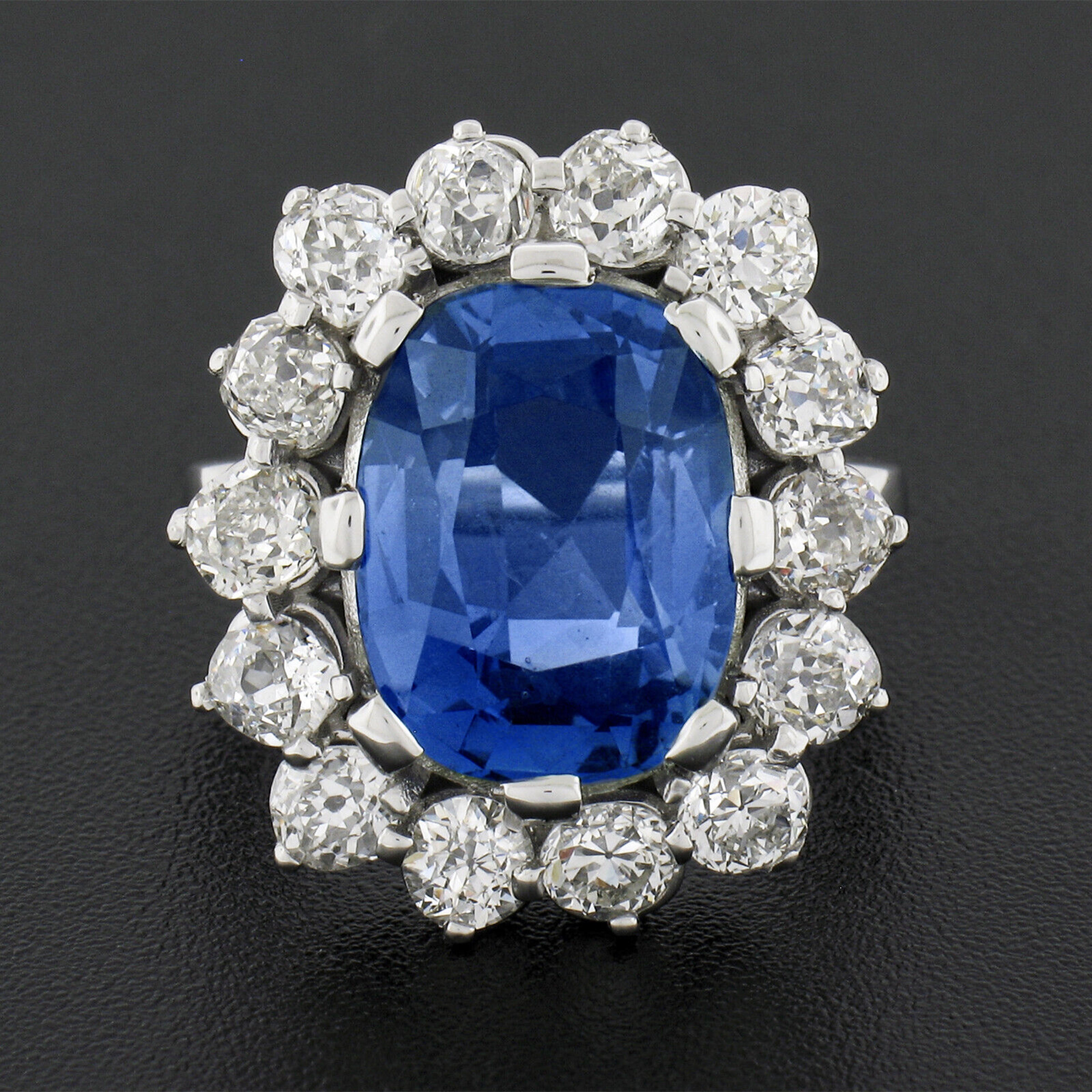 You are looking at a truly breathtaking, custom designed, sapphire and diamond platter ring that is newly crafted in solid platinum. This brand new ring is set with antique stones featuring a large, AGL certified, Ceylon sapphire stone that is