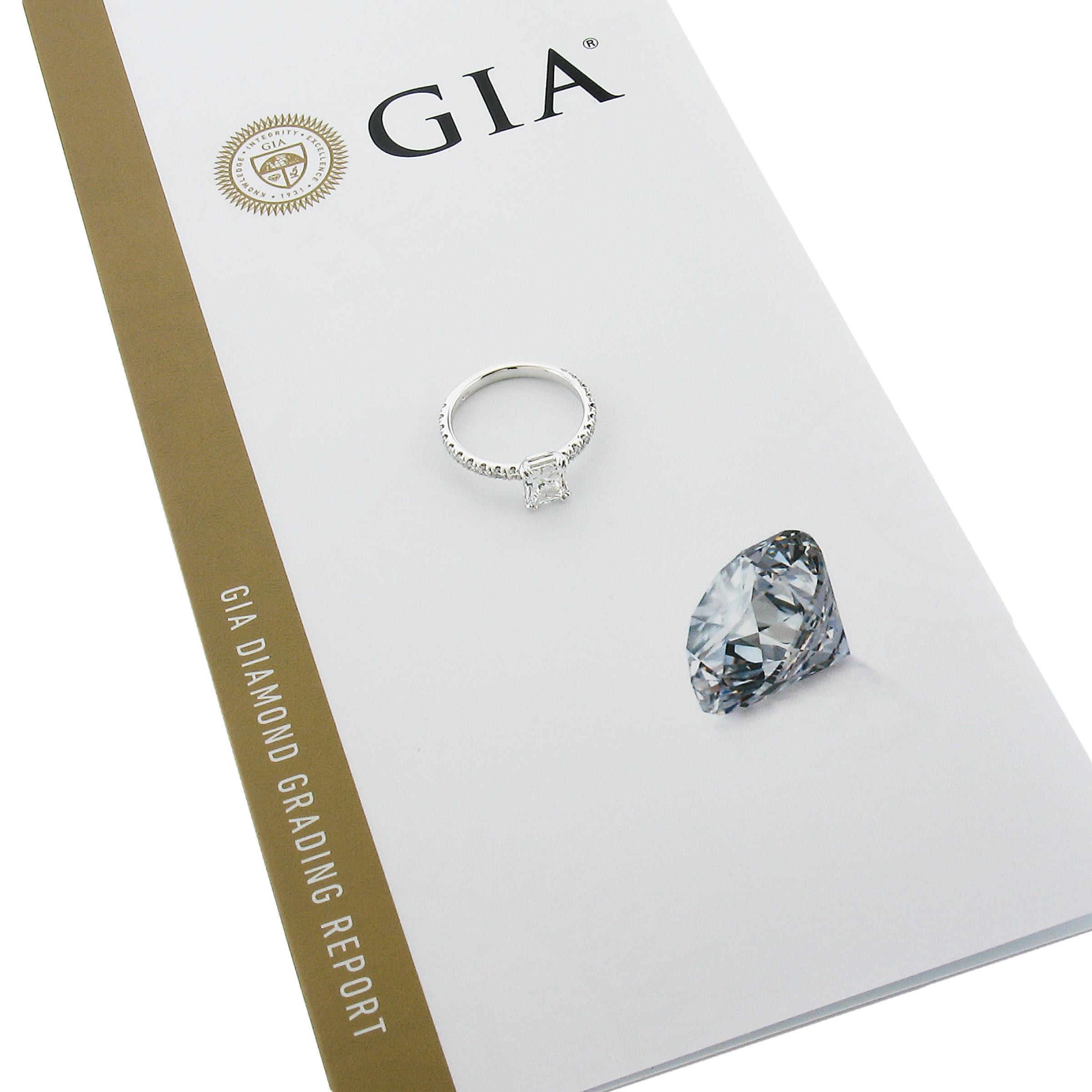 --Stone(s):--
(1) Natural Genuine Diamond - Elongated Radiant Cut - Double Claw Prong Set - F Color - SI1 Clarity - 1.04ct (exact - certified) **See Certifications Details Below**
(20) Natural Genuine Diamonds - Round Brilliant Cut - Pave Set - F/G