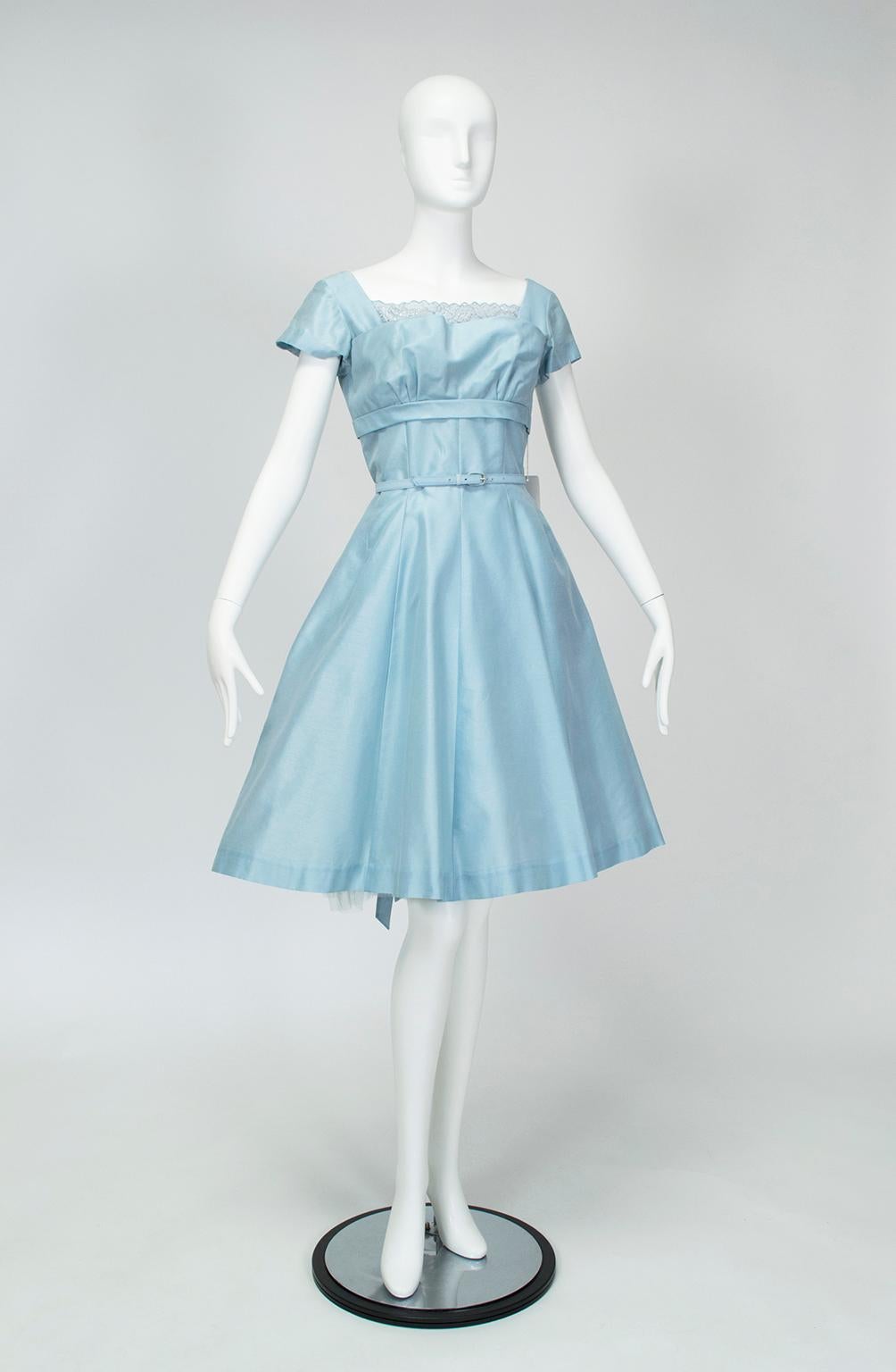 A honeymoon dress that was never worn (because the groom shipped out to Korea immediately after the wedding), this dress is the pinnacle of femininity. Oozing with propriety, from its petal-gathered shelf bust to its attached crinoline.

Short