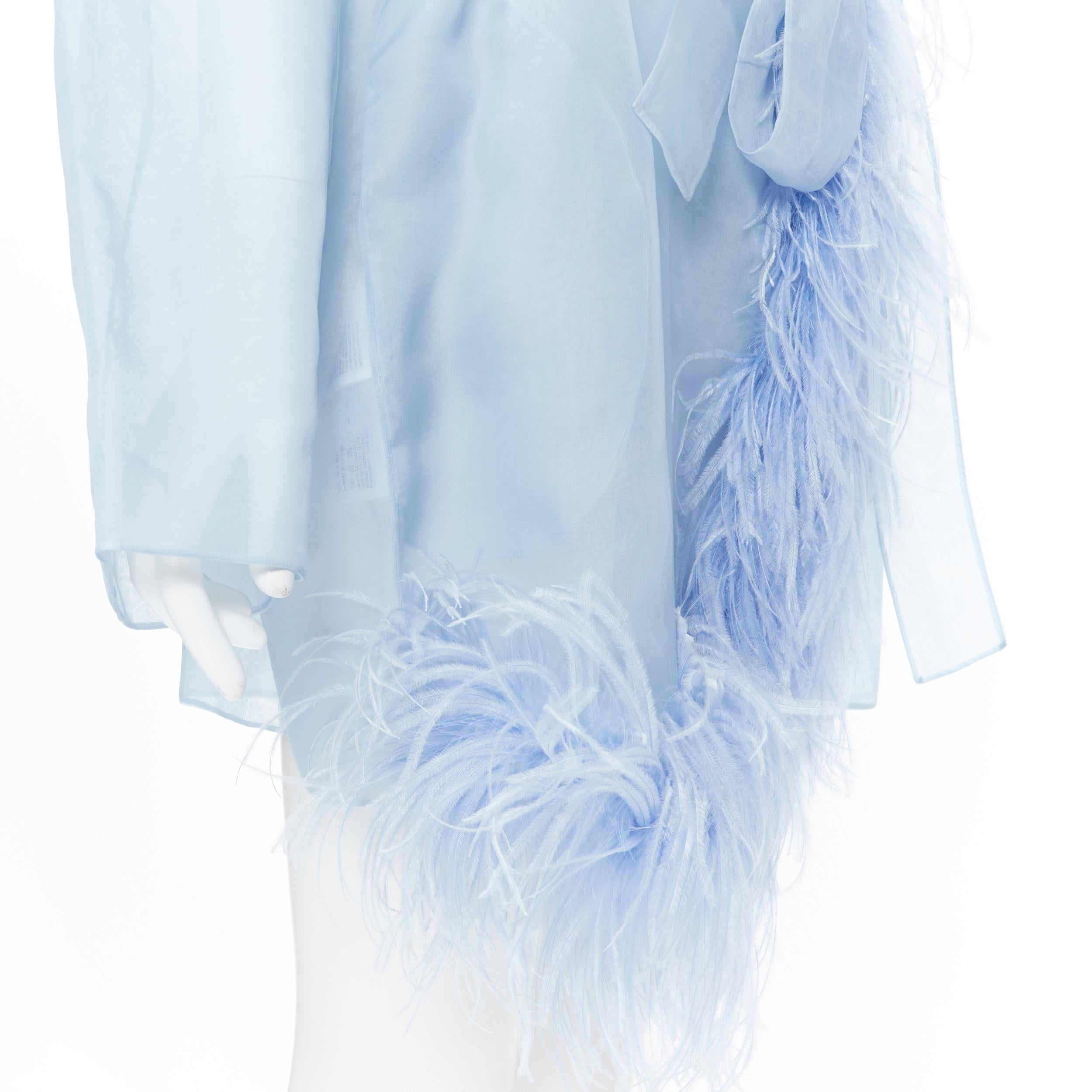 new PRADA 100% silk blue sheer feather trimmed hem belted shawl robe coat M
Brand: Prada
Designer: Miuccia Prada
As seen on: Rihanna, Kendall Jenner, Kris Jenner
Model Name / Style: Robe
Material: Silk
Color: Blue
Pattern: Solid
Extra Detail: Shawl