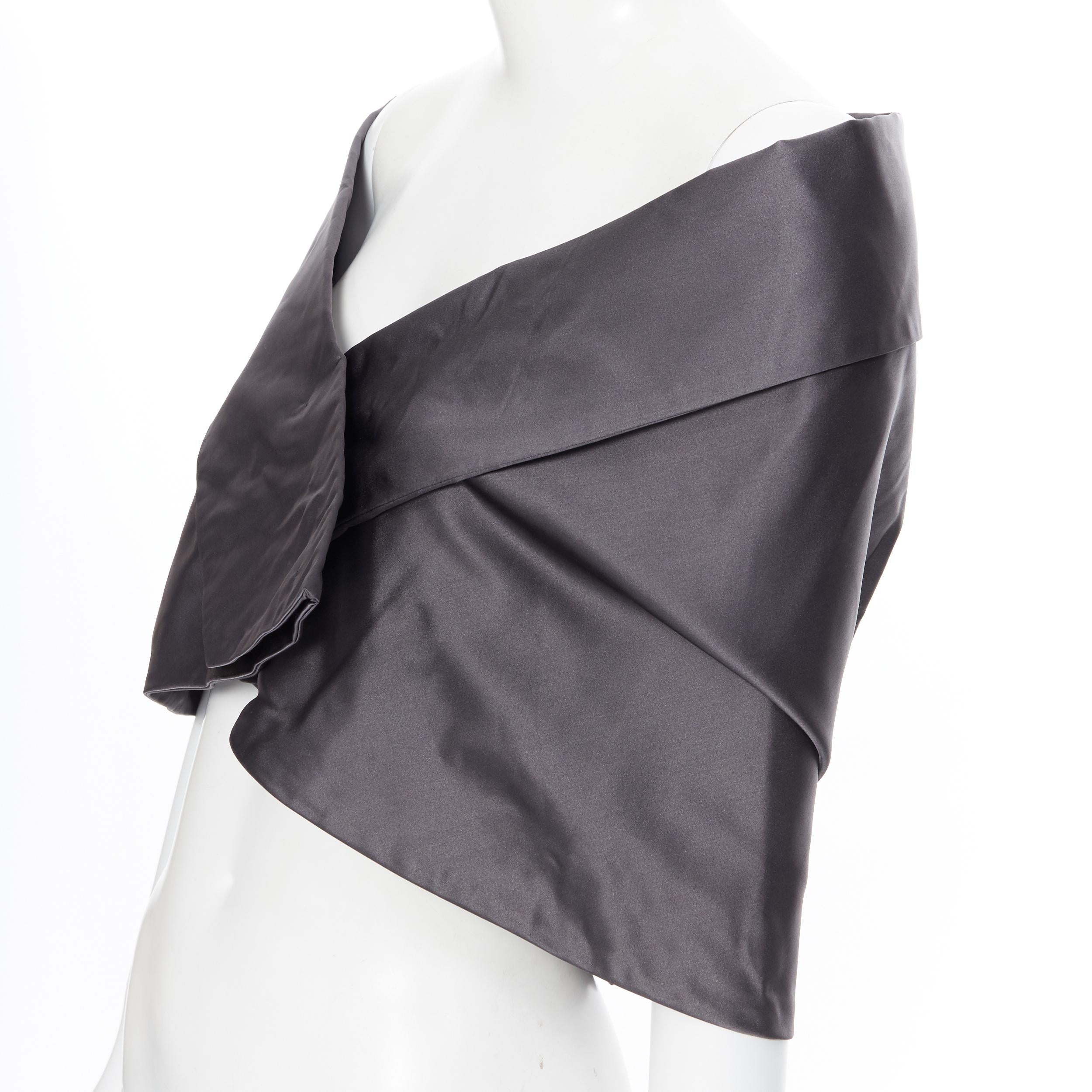new PRADA 100% silk dark grey kimono collar off shoulder shawl cape
Brand: Prada
Designer: Miuccia Prada
Model Name / Style: Kimono capelet
Material: Silk
Color: Grey
Pattern: Solid
Closure: Button
Extra Detail: Concealed snap button front