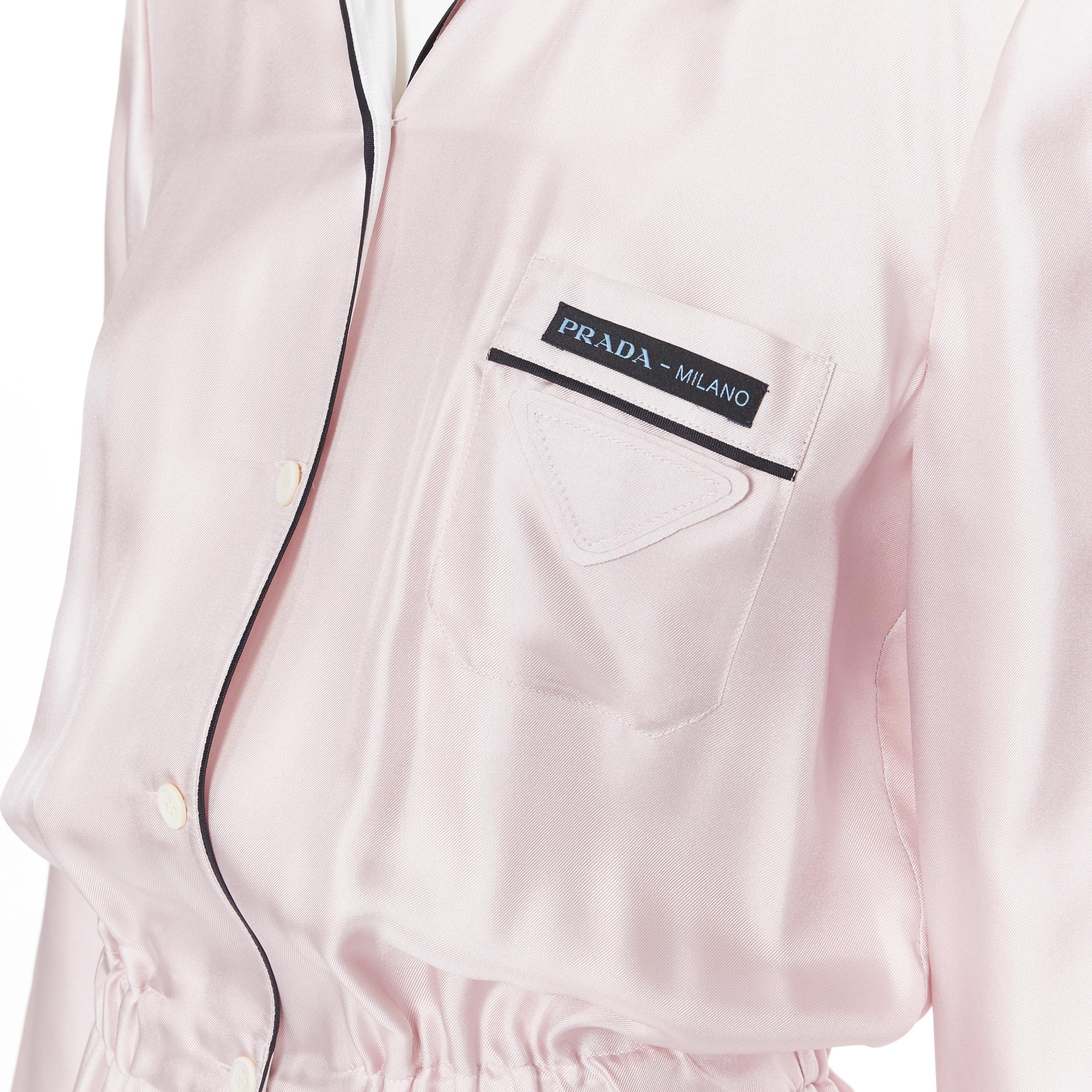 new PRADA 100% silk triangle logo pocket lounge wear pyjama style jumpsuit IT38
Brand: Prada
Designer: Miuccia Prada
Model Name / Style: Silk jumpsuit
Material: Silk
Color: Pink
Pattern: Solid
Closure: Button
Extra Detail: Signature Prada logo tab