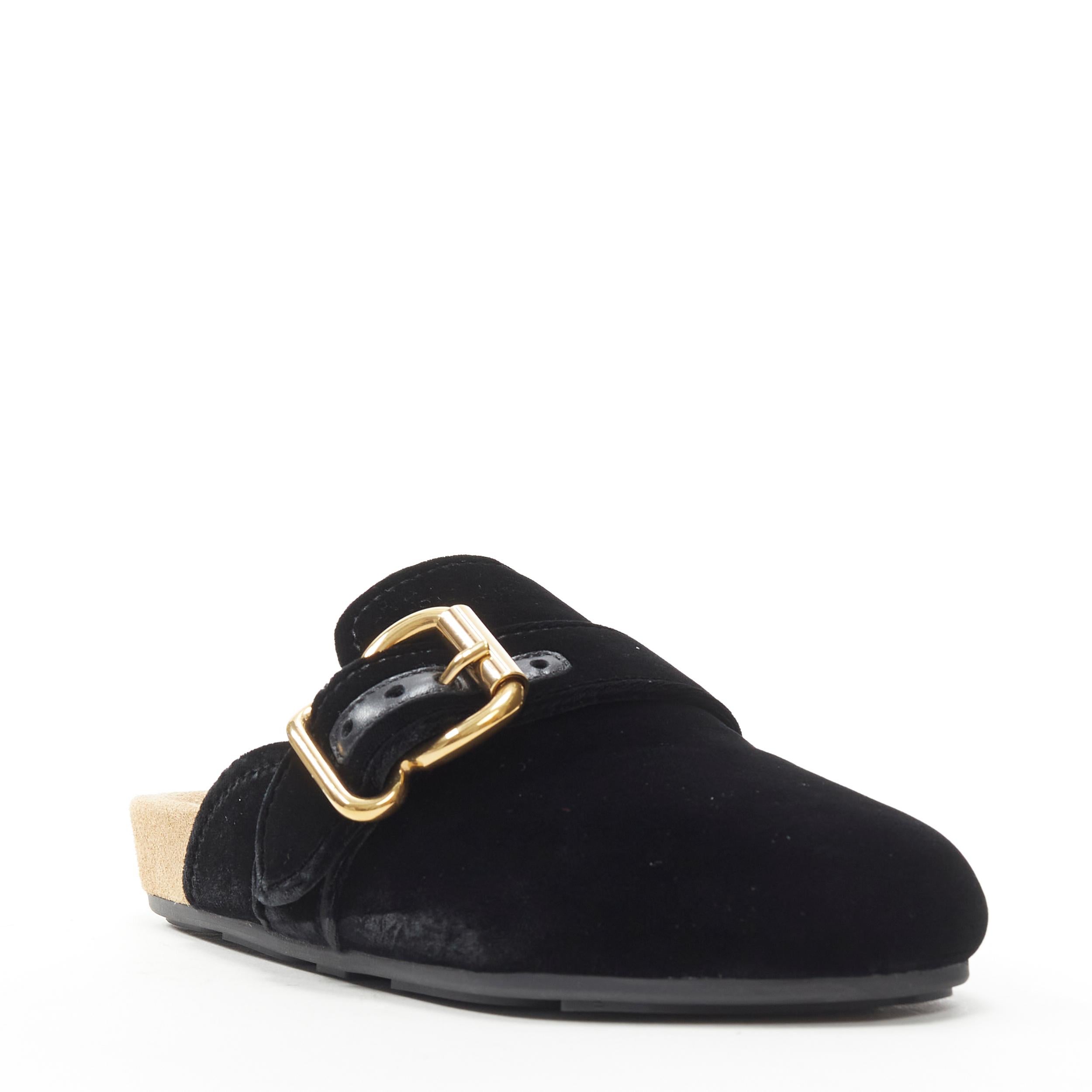 new PRADA 2018 black velvet gold buckle round toe mule clog birkenstock EU36 US6 
Reference: TGAS/B00934 
Brand: Prada 
Designer: Miuccia Prada 
Model: Velvet mule black 
Collection: 2018 
Material: Velvet 
Color: Black 
Pattern: Solid 
Extra